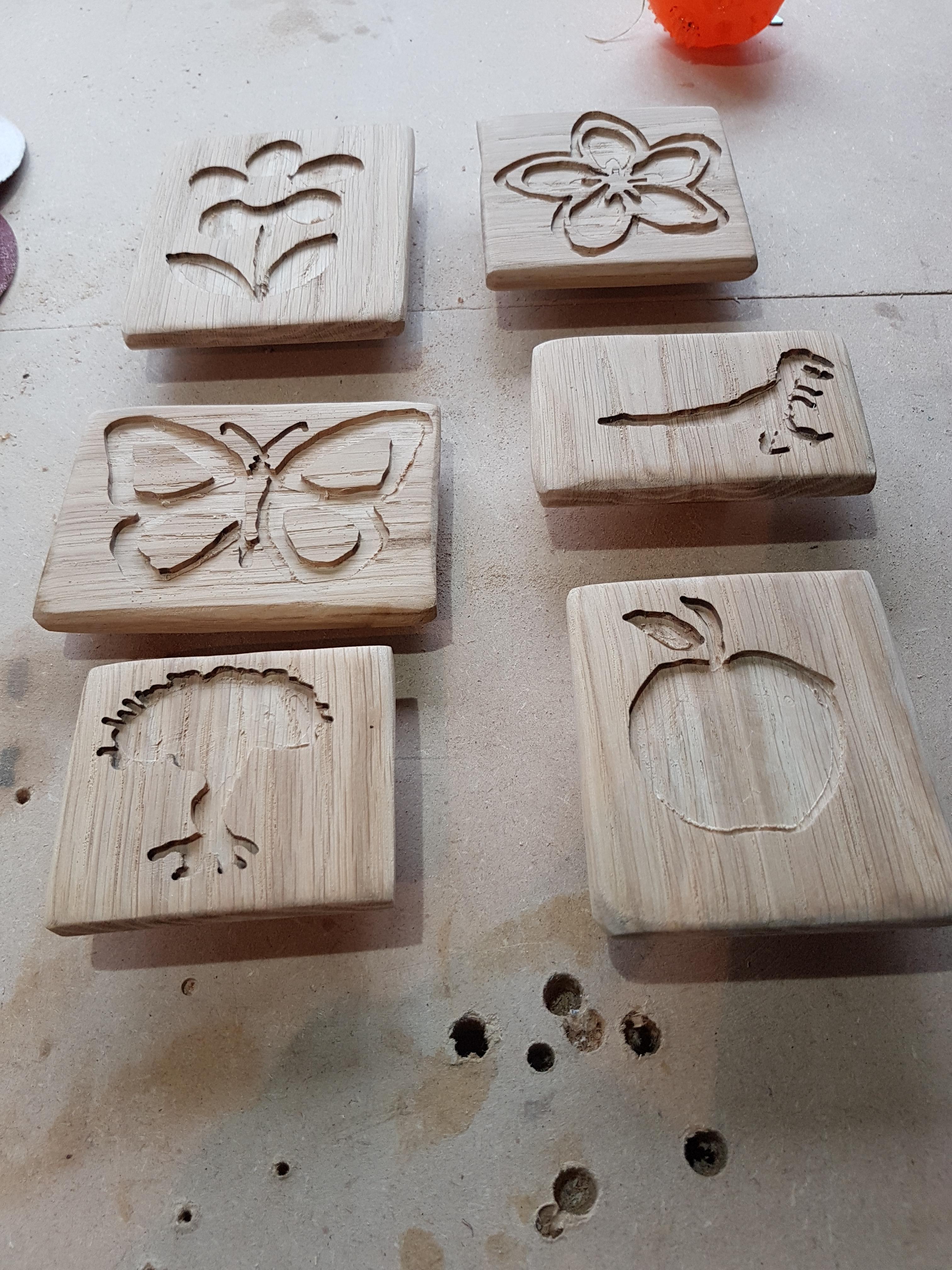 Some more free hand wooden stamps from my son. Oak r/woodworking