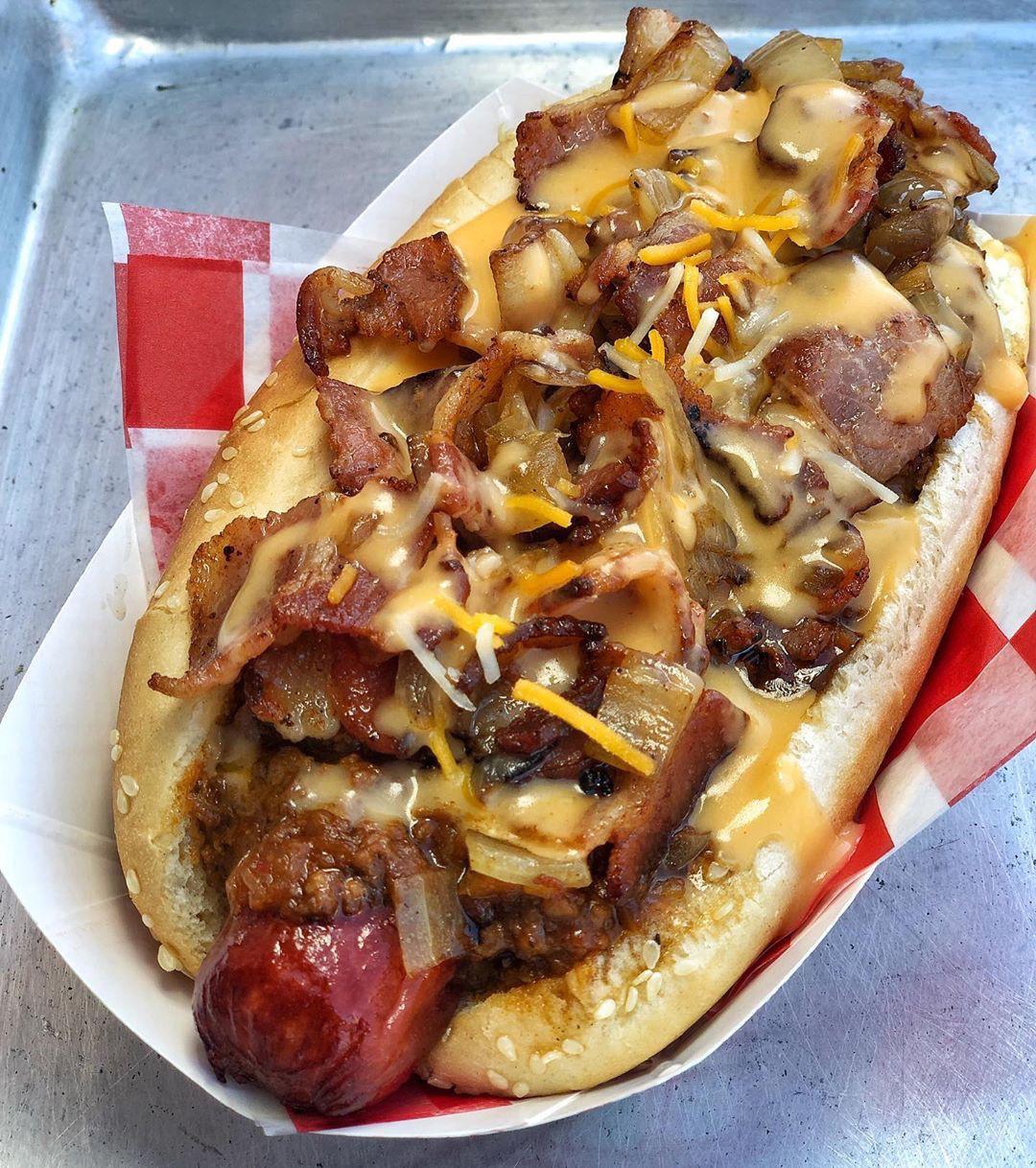 [i ate] Beef hotdog on a toasted bun topped with chilli, bacon, cheese