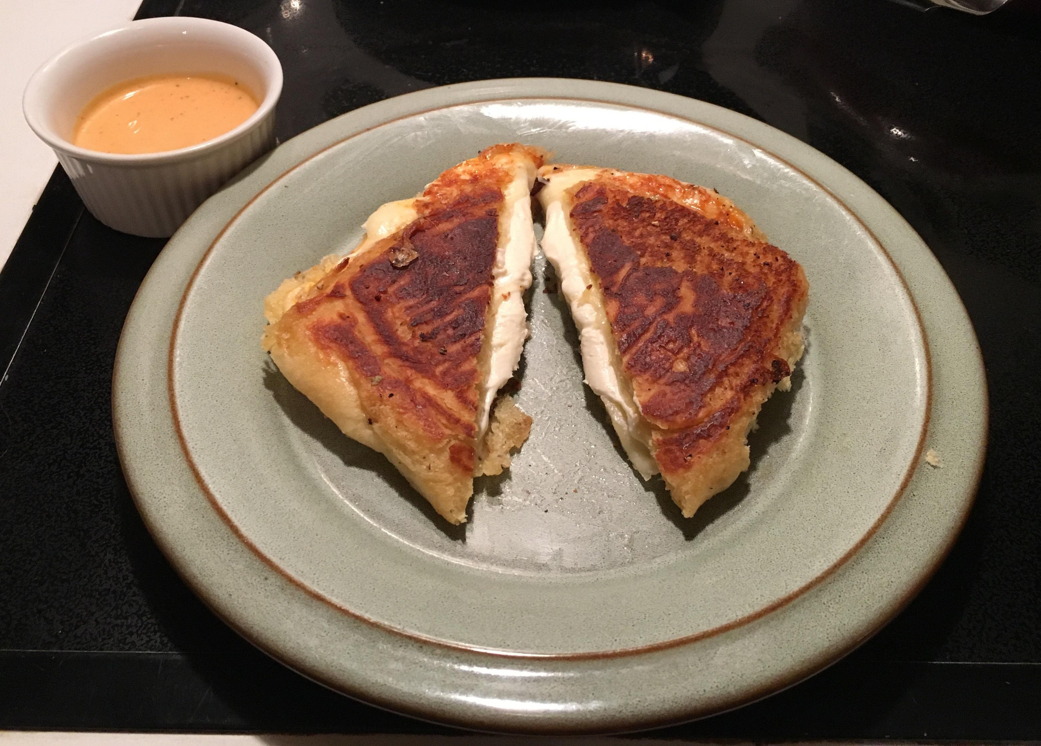 Muenster and Cream Cheese on garlic roll with Sriracha ranch sauce to