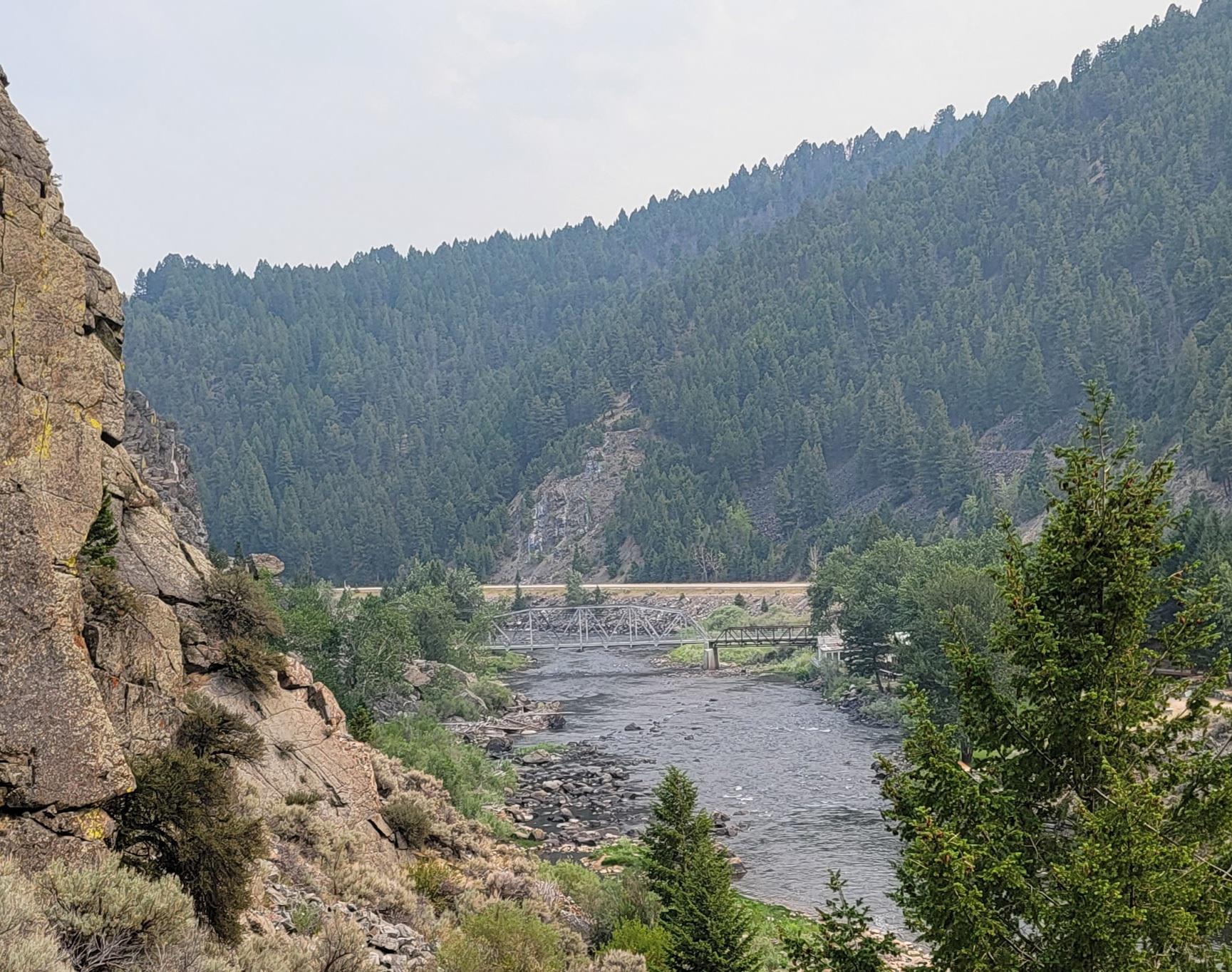 The old steel bridge on the Big Hole River near Divide on a smokey