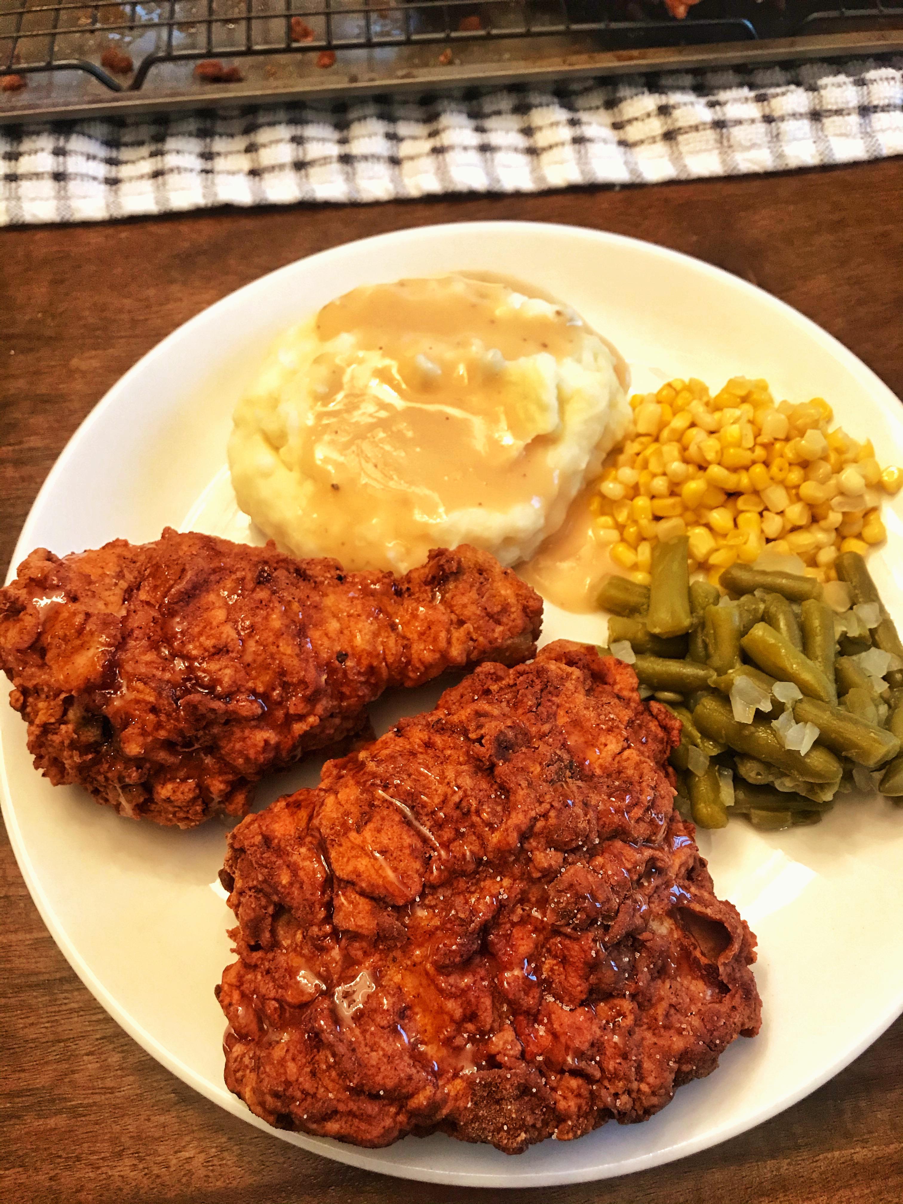 Homemade hot honey fried chicken, corn, green beans, mashed potatoes