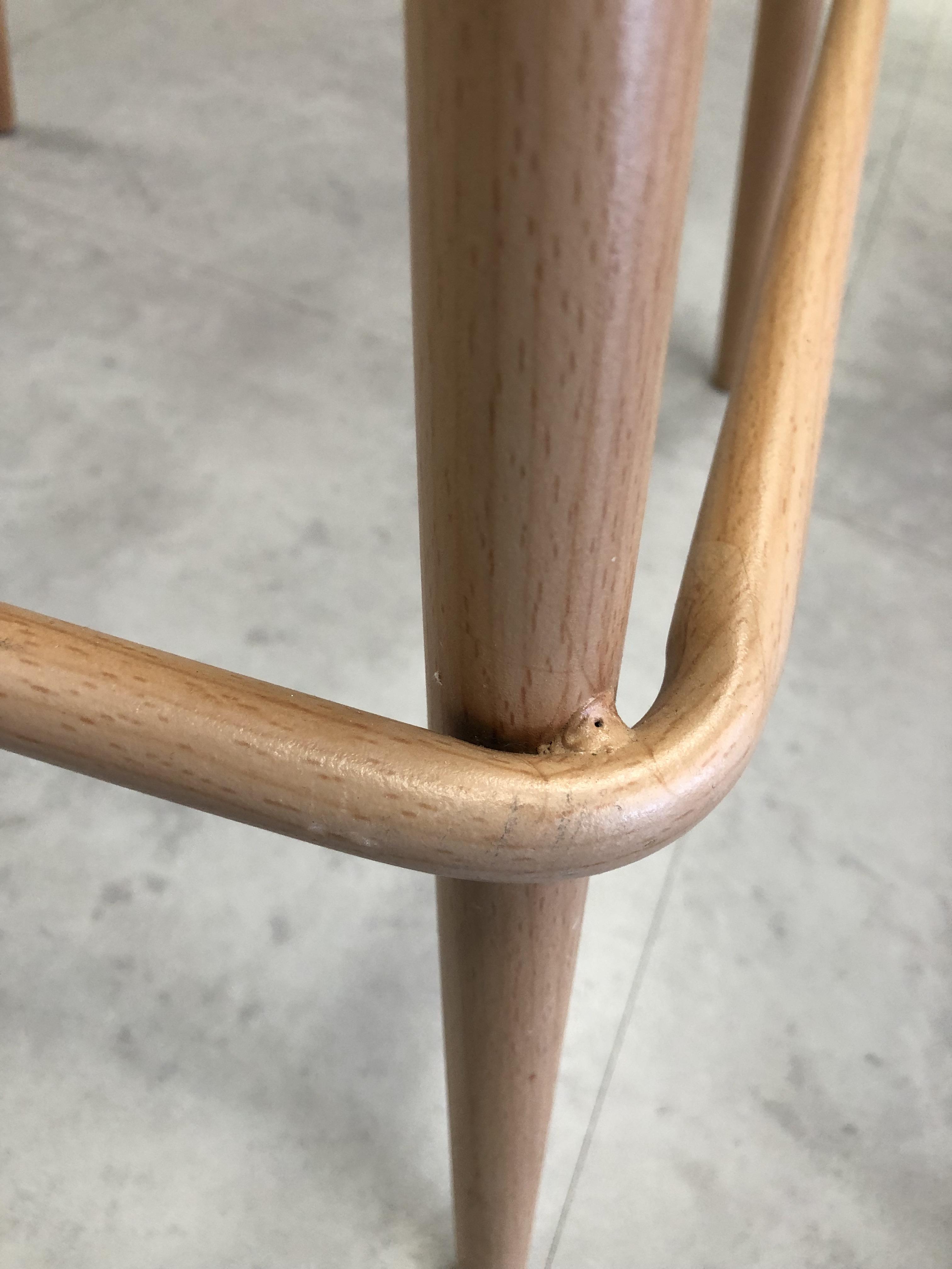 These chair legs are welded metal, but wrapped to look and feel like