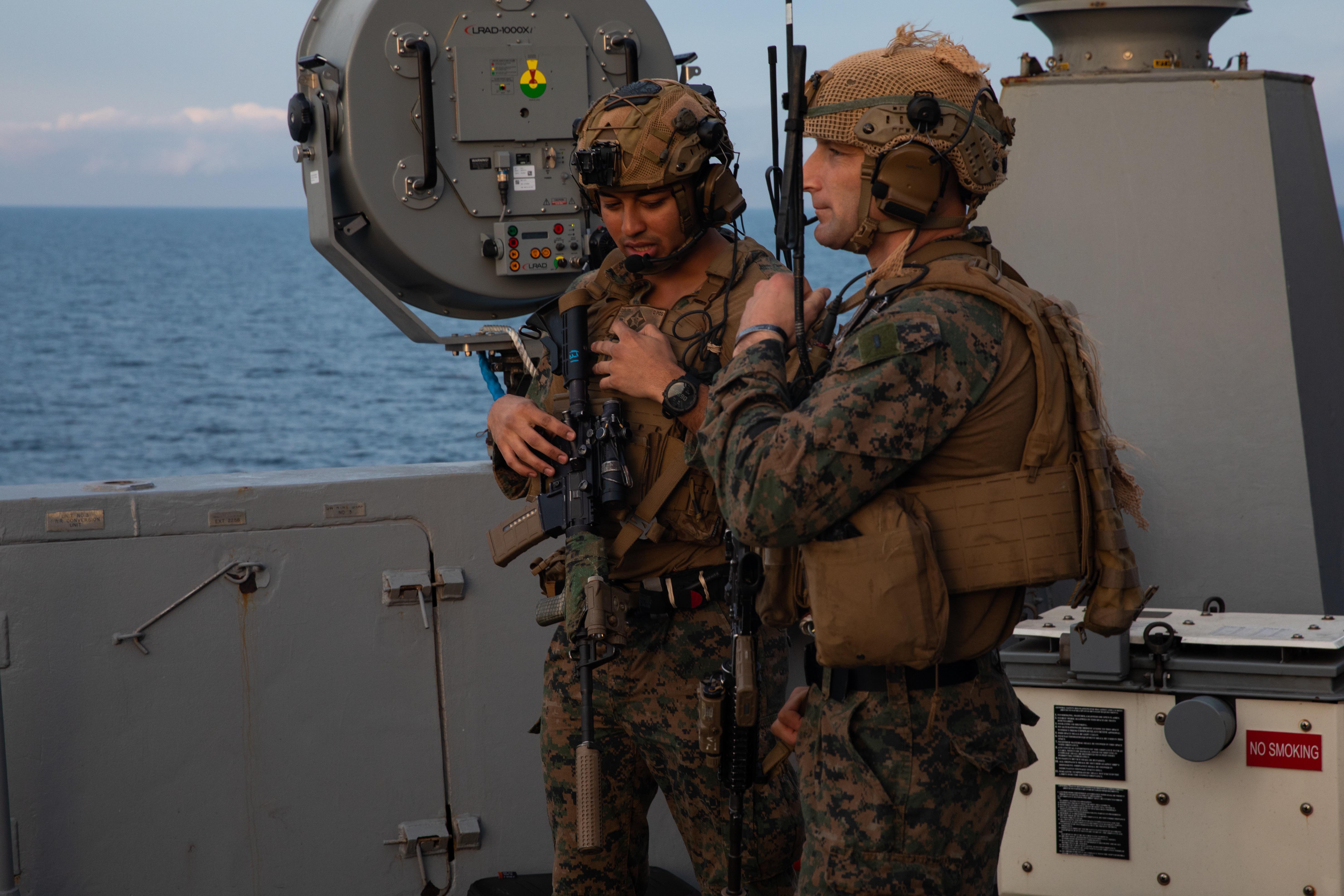 Two Marine officers assigned to Echo Company, Battalion Landing Team 2/6, 22nd Marine