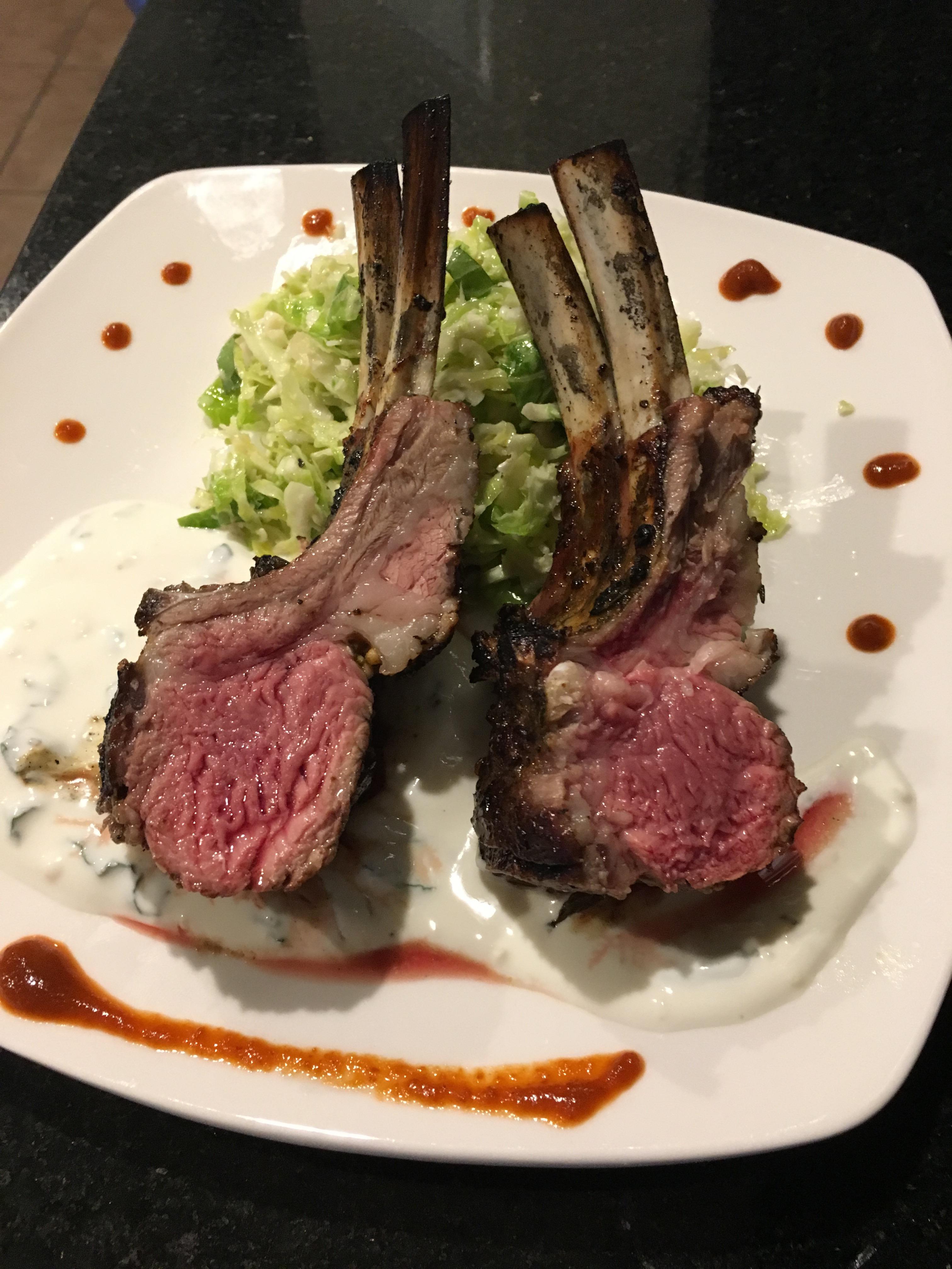 Rack of lamb with brussel sprout slaw and mint yogurt sauce. Done on my