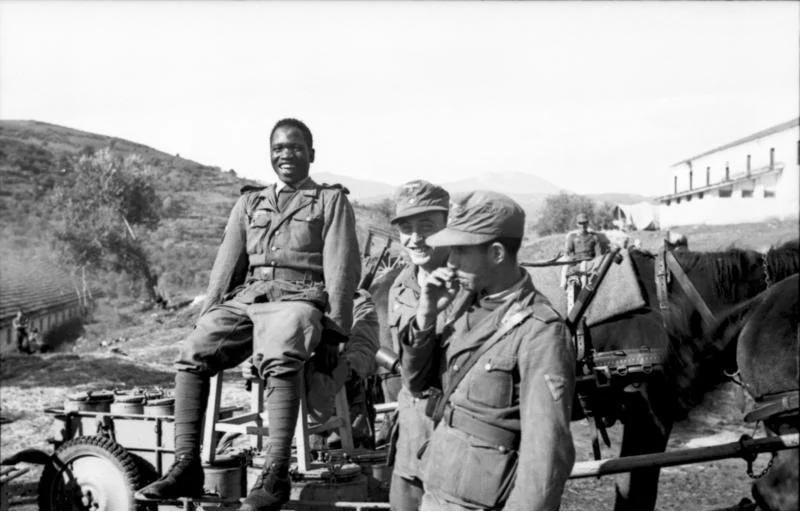 An AfroGerman WaffenSS Soldier of the Free Arabian Legion having a