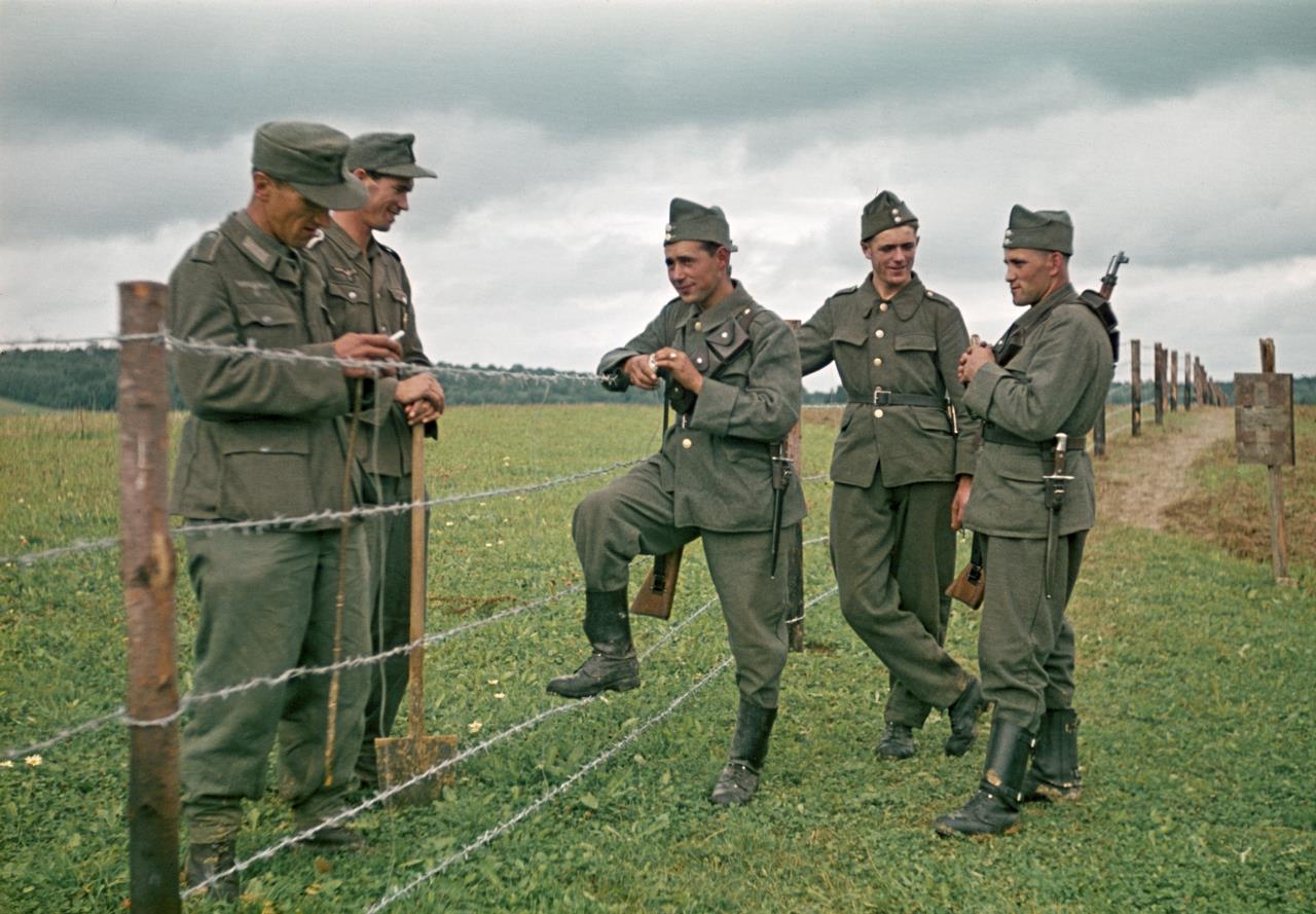 German soldiers speaking with swiss border guards, 1944. r/ww2