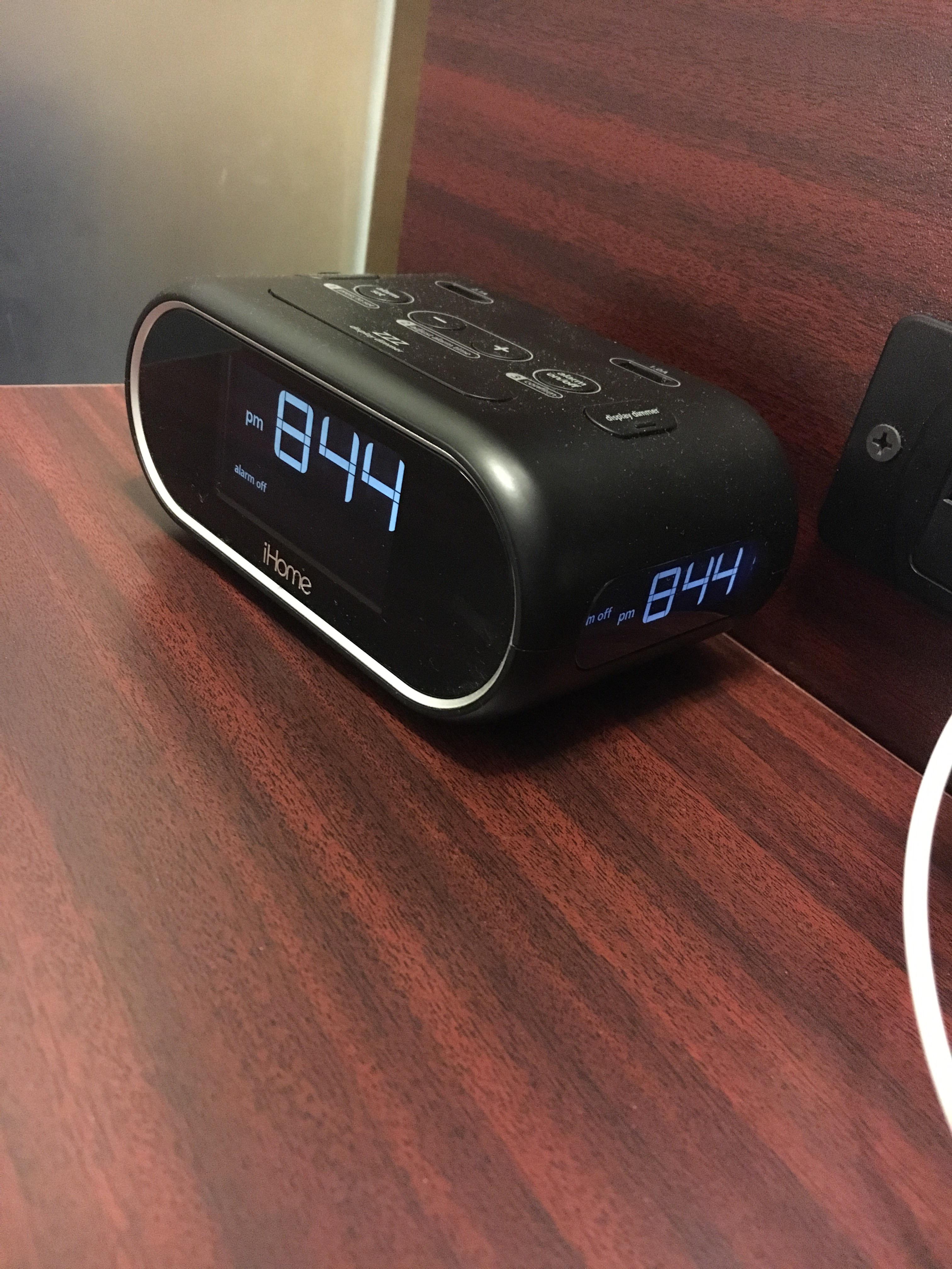 This hotel alarm clock shows the time on the front and the side r