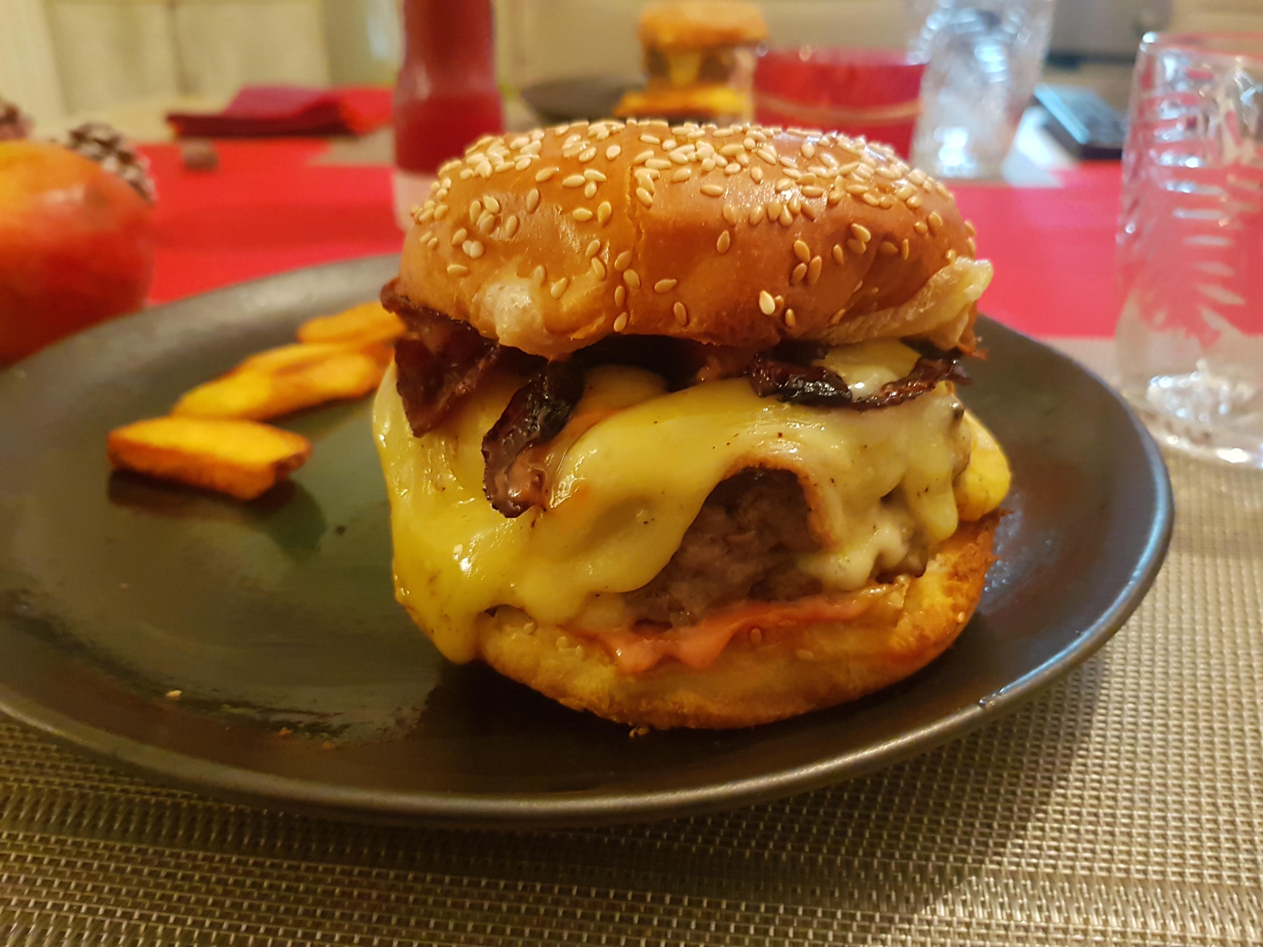 Burger with Raclette cheese, bacon and caramelized onions. burgers