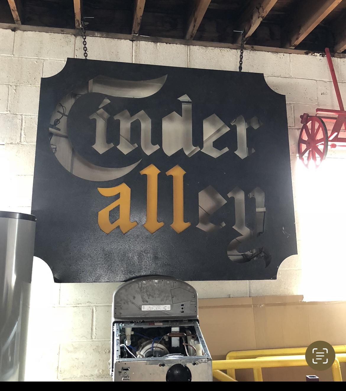 The original Cinder Alley sign from Cinderella City mall still exists