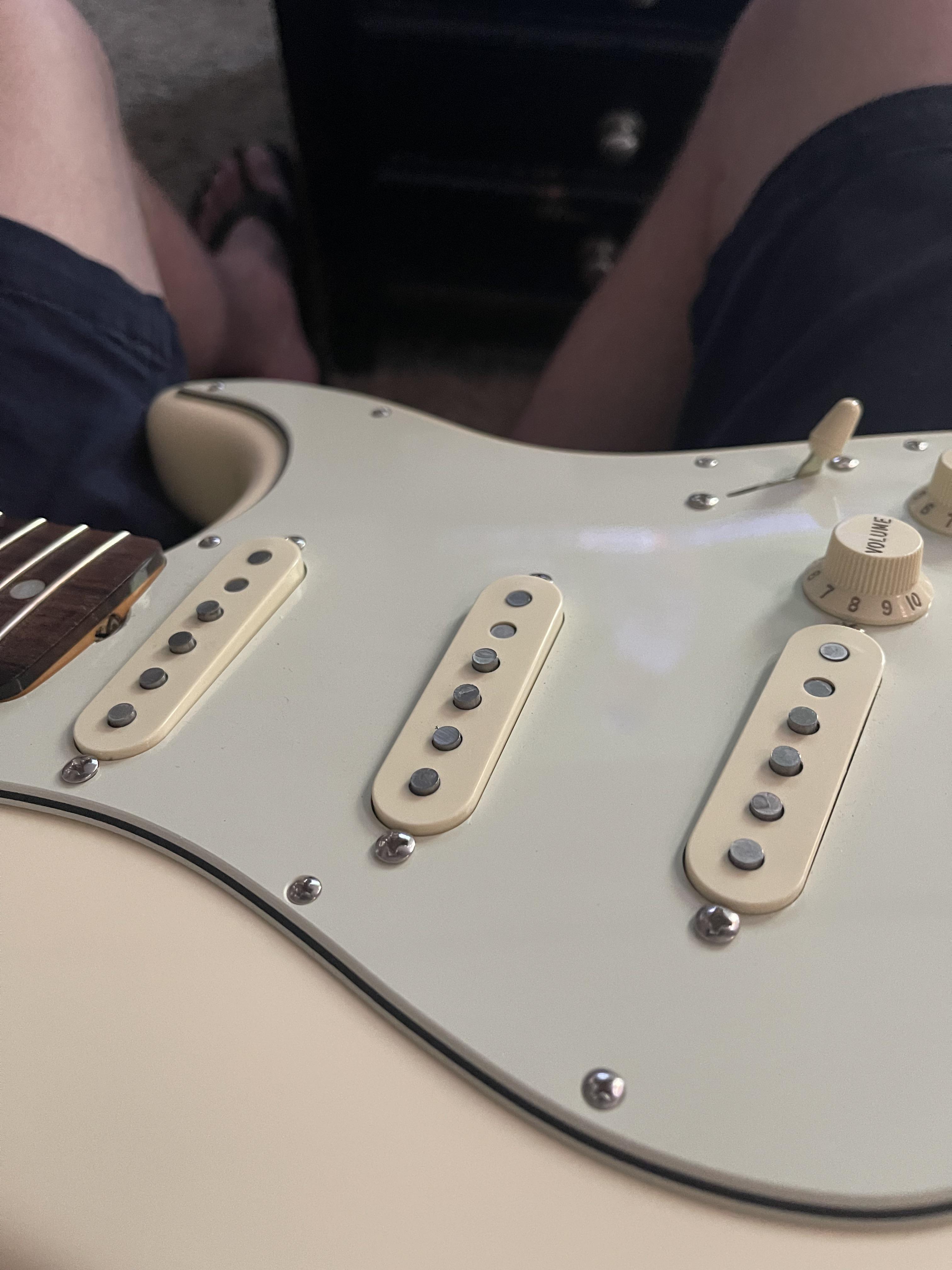 This is my 1963 strat reissue. I know almost nothing about guitar setup