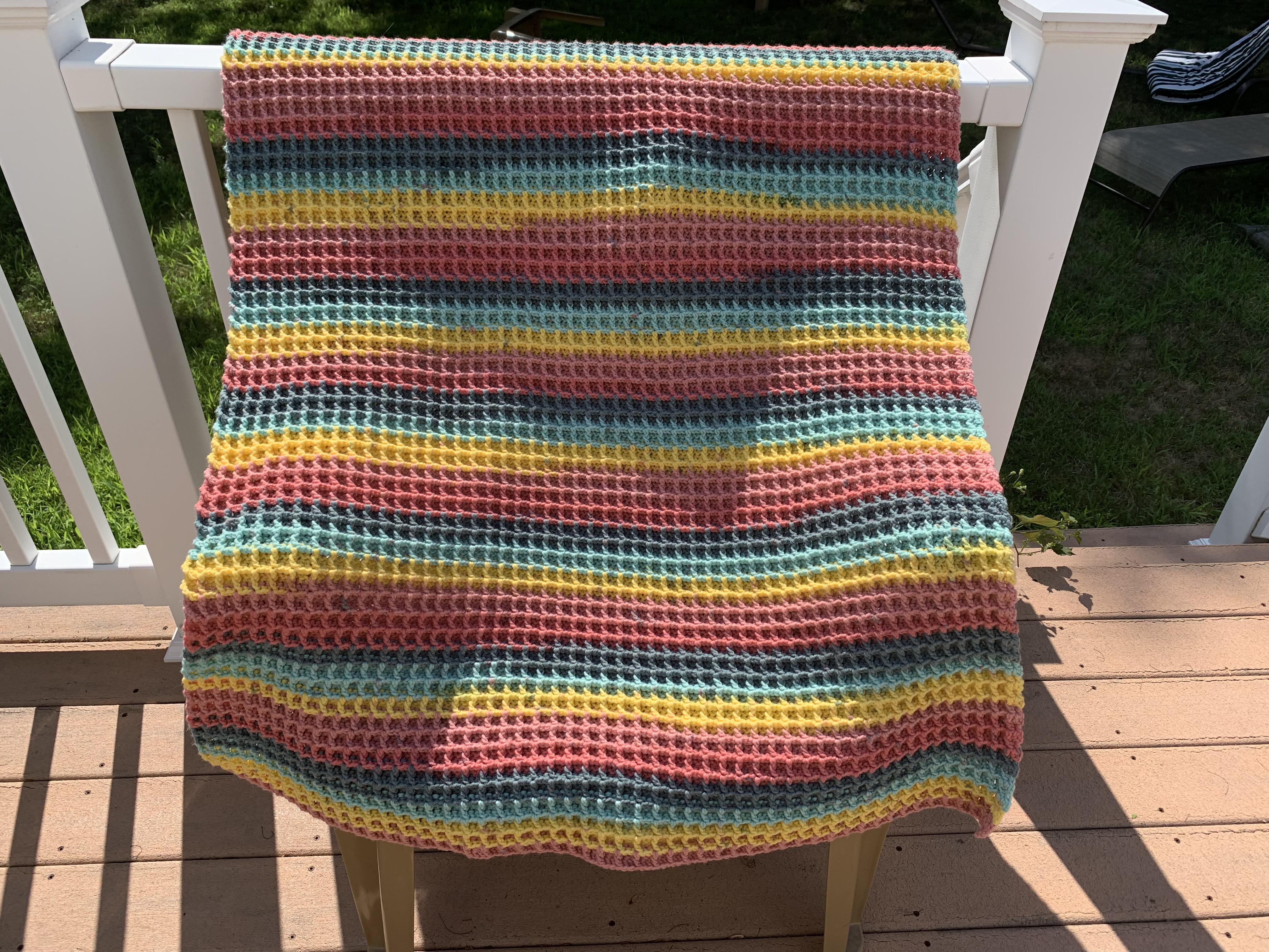 Finally finished tying in all the ends on this waffle stitch blanket
