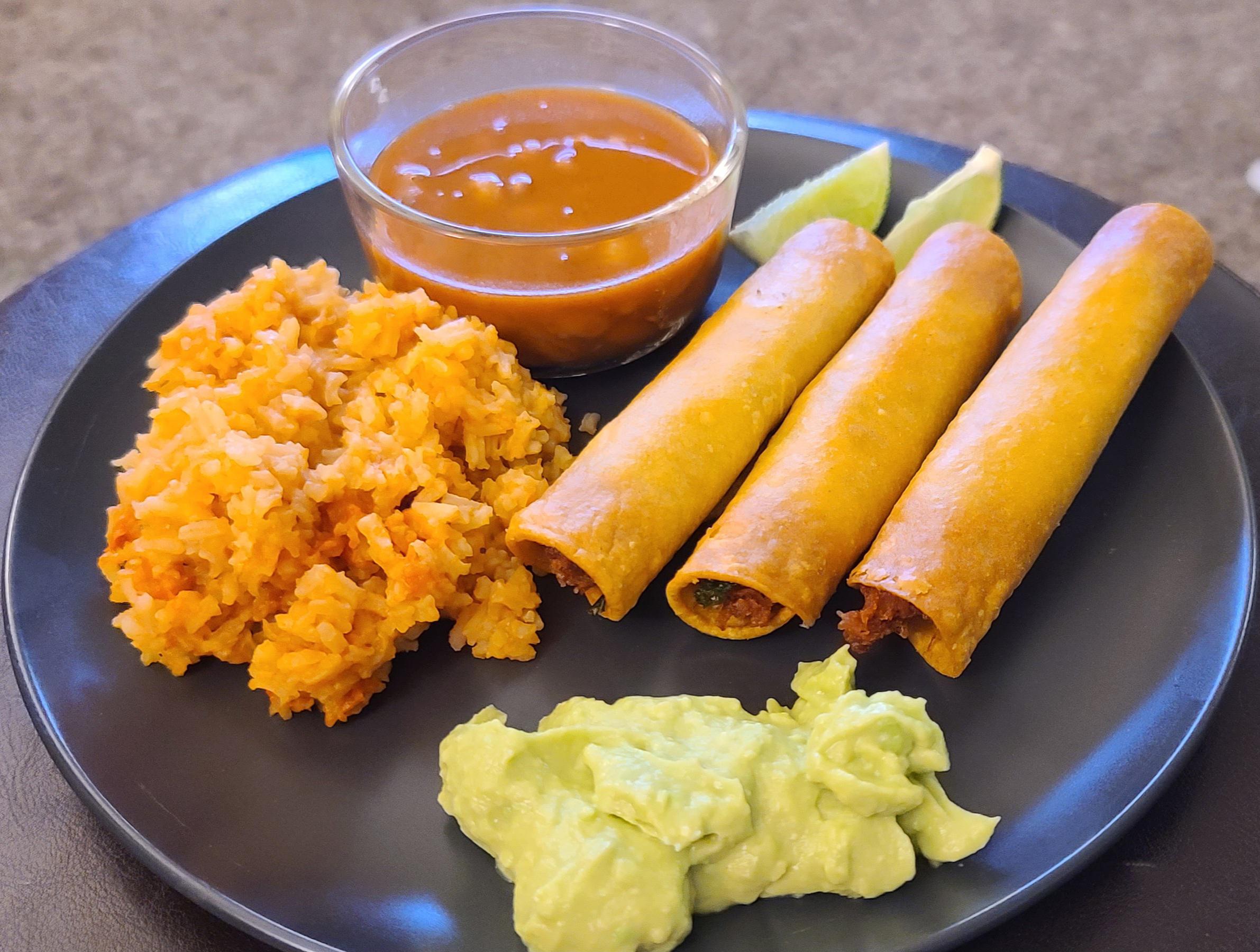 [homemade] chicken flautas, rice, beans, and guacamole. r/food
