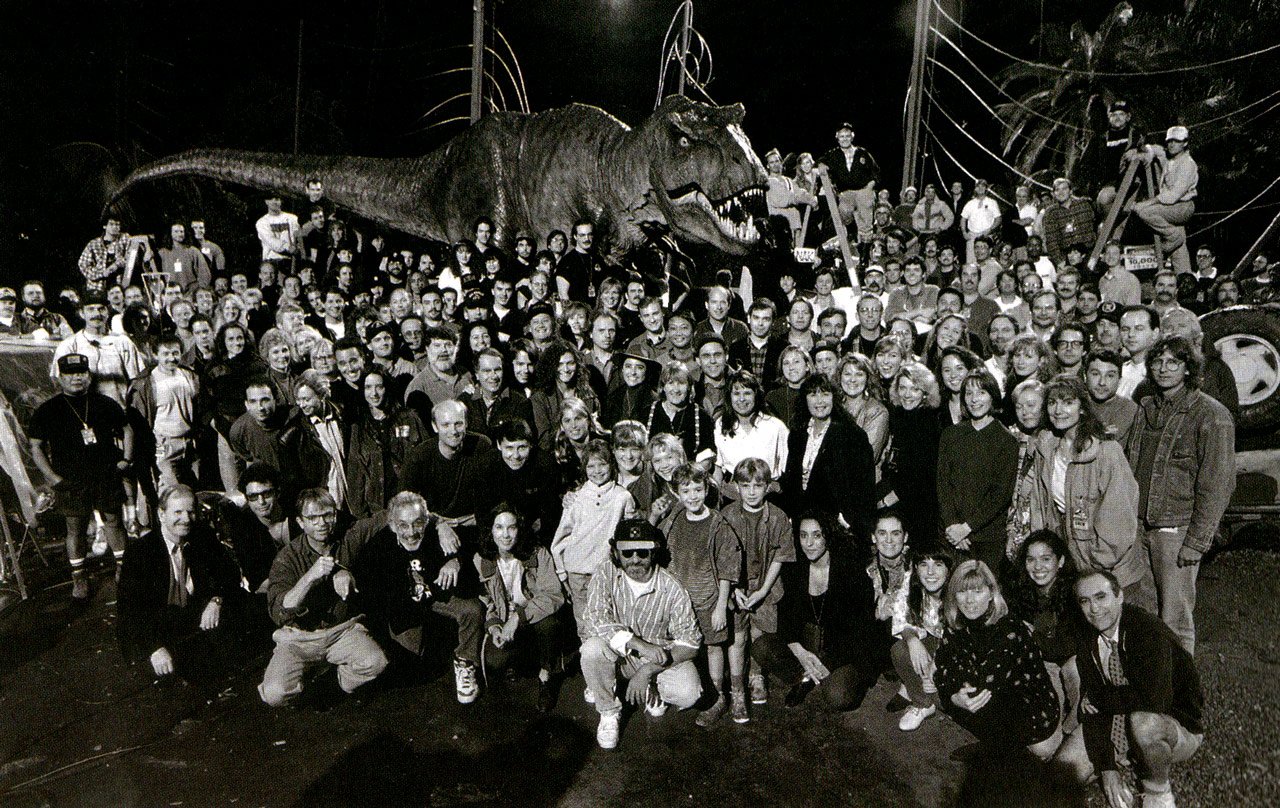 The cast and crew of JURASSIC PARK pose for a photo on Warner Bros. Studios' Stage 16 with the T