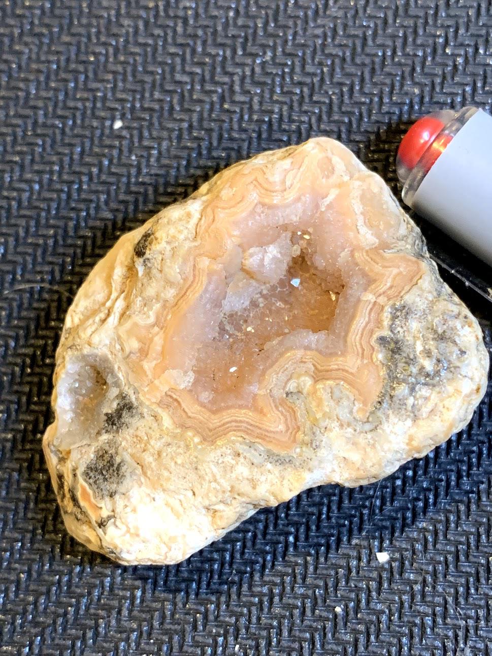 Found in gravel in Muscatine, Iowa. Agatelike lines around a salmon