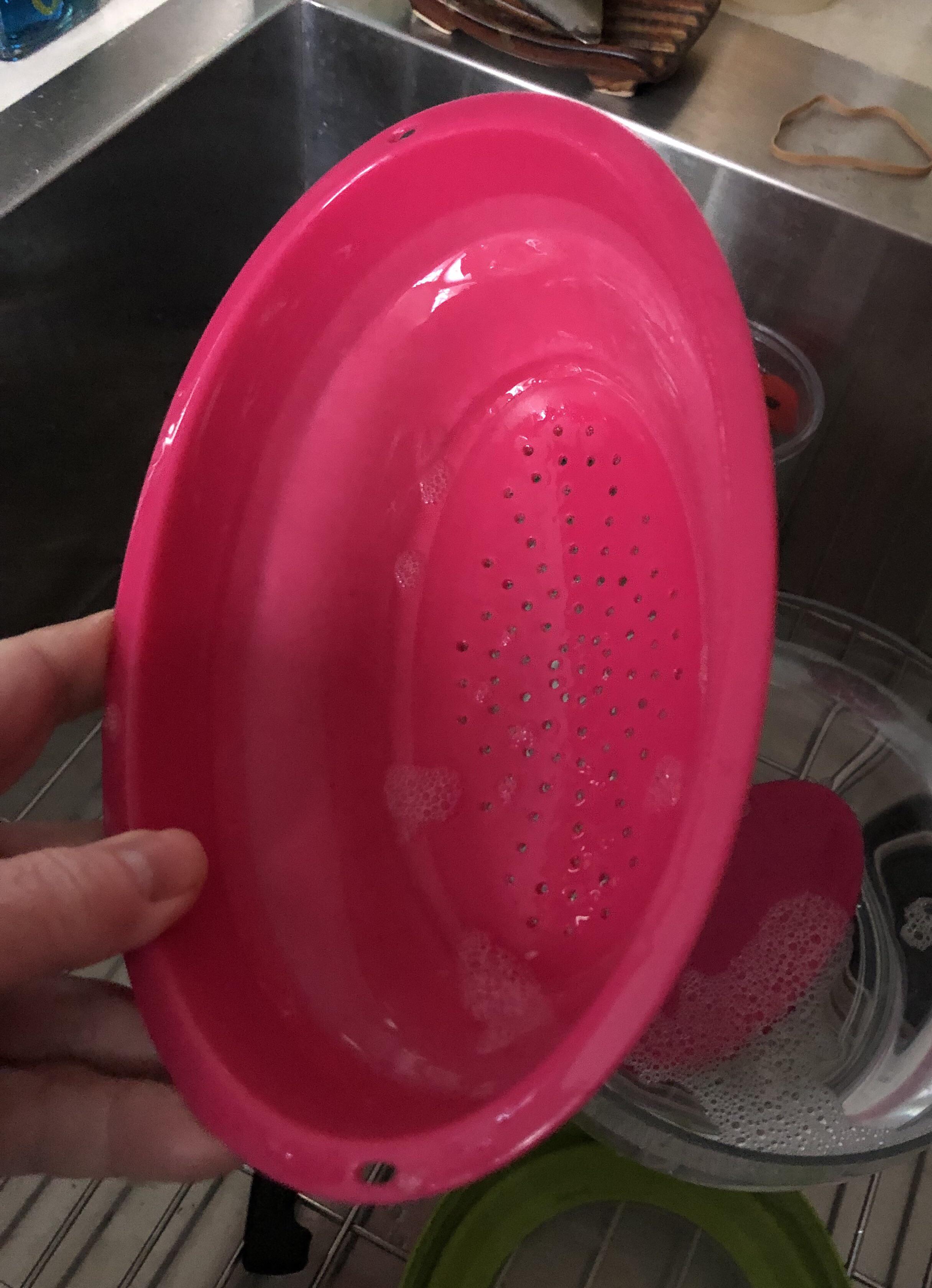 This collapsible colander/berry bowl has suddenly developed sticky