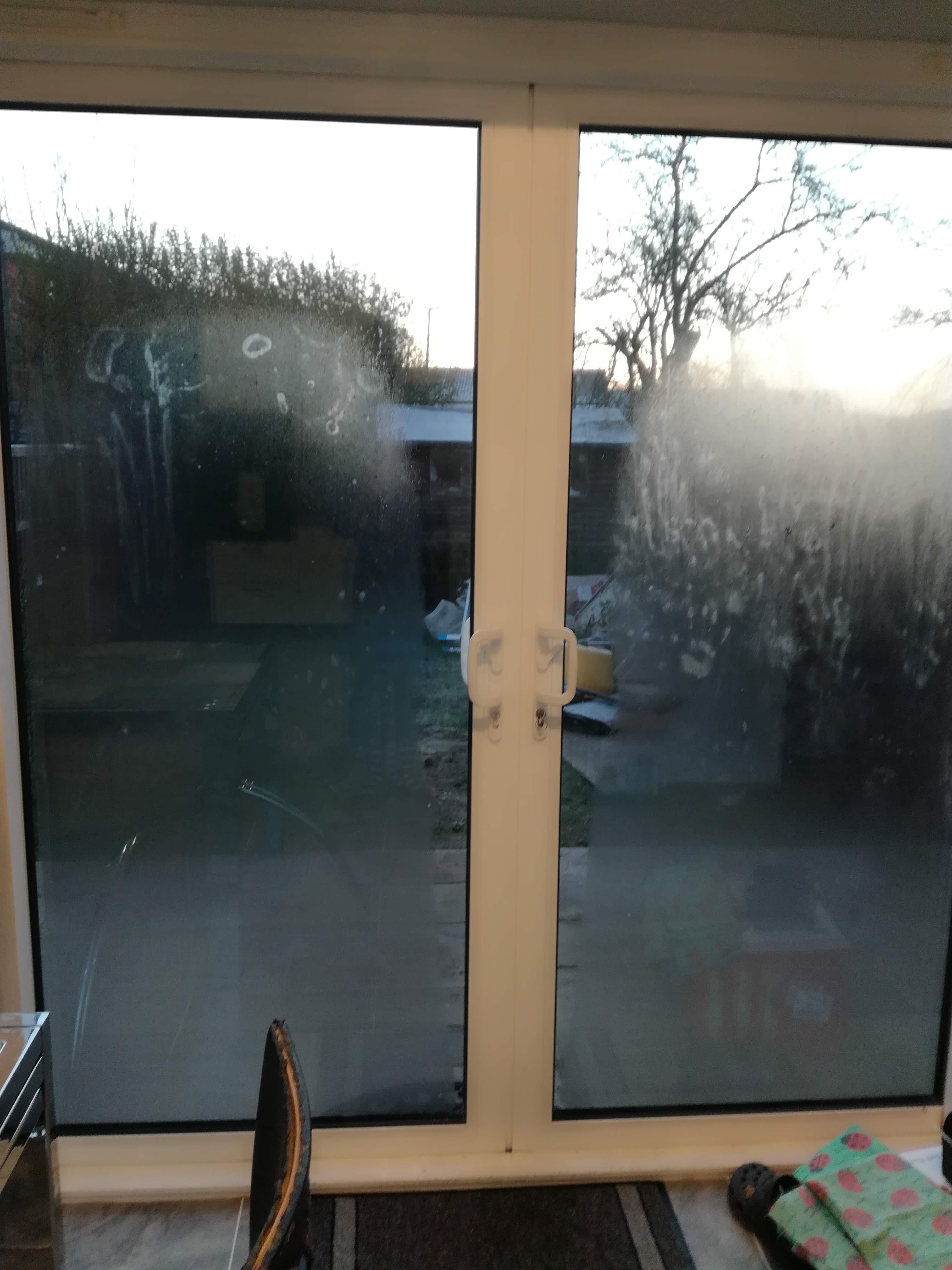 The condensation on my kitchen door revealed all the handprints left on