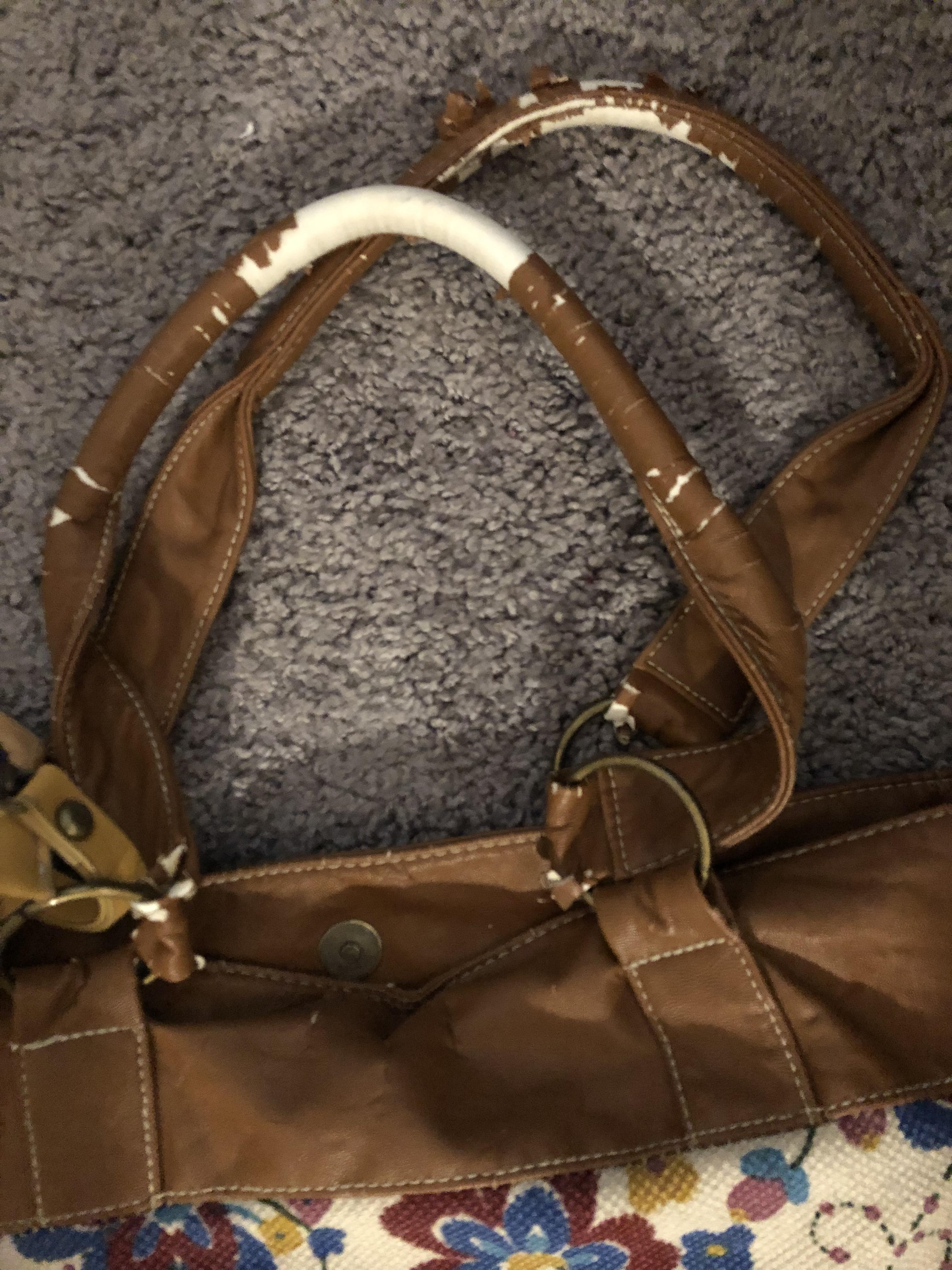 How can I repair the worn material on the handles of this bag? r