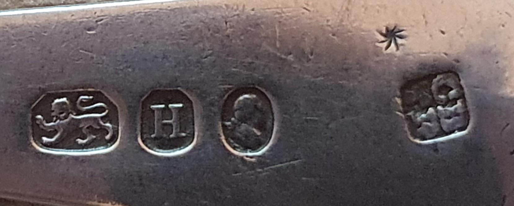 Trying to determine markings on silver spoon. Help appreciated. r