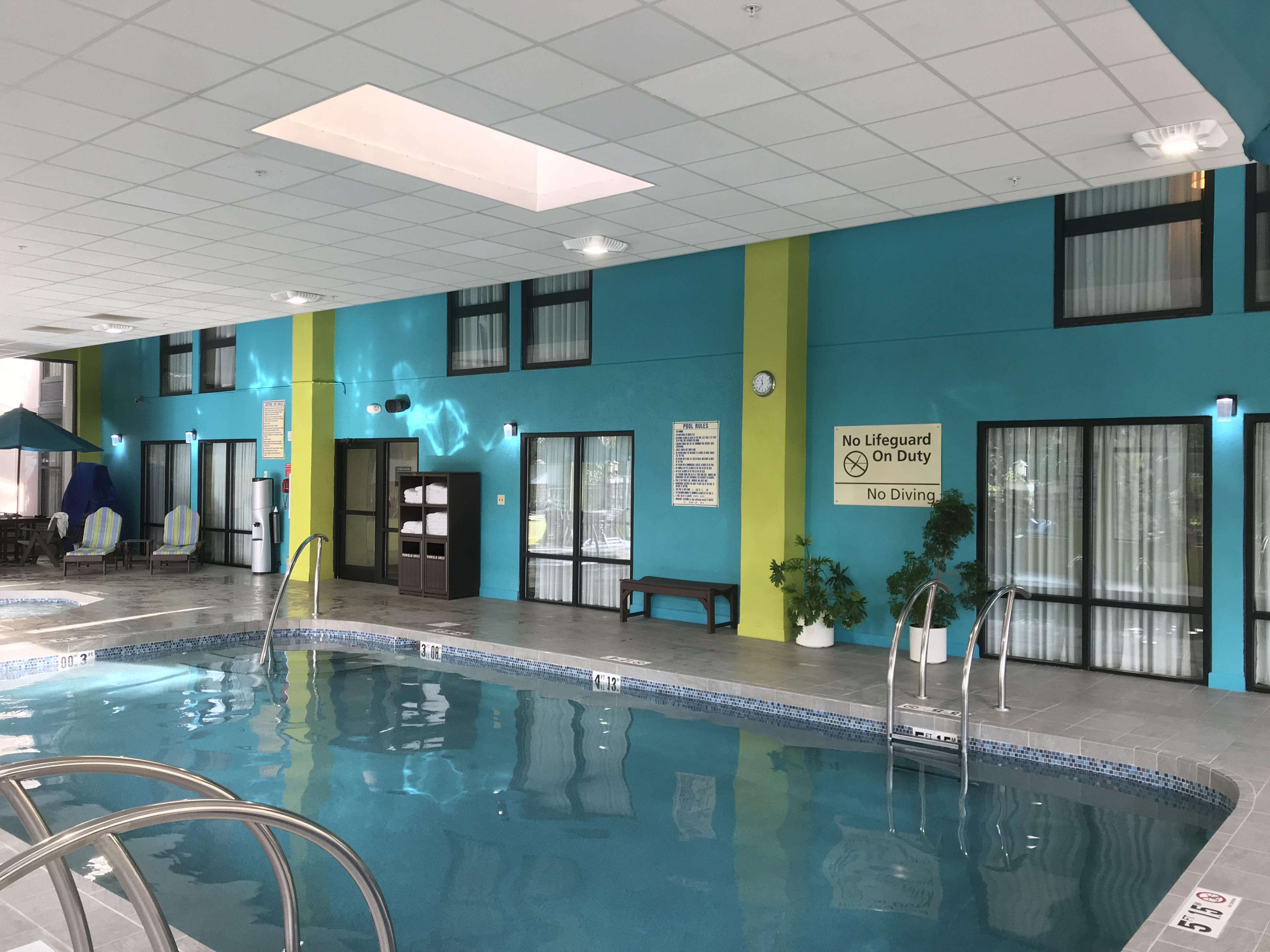 The indoor pool at this hotel has room windows overlooking the pool r
