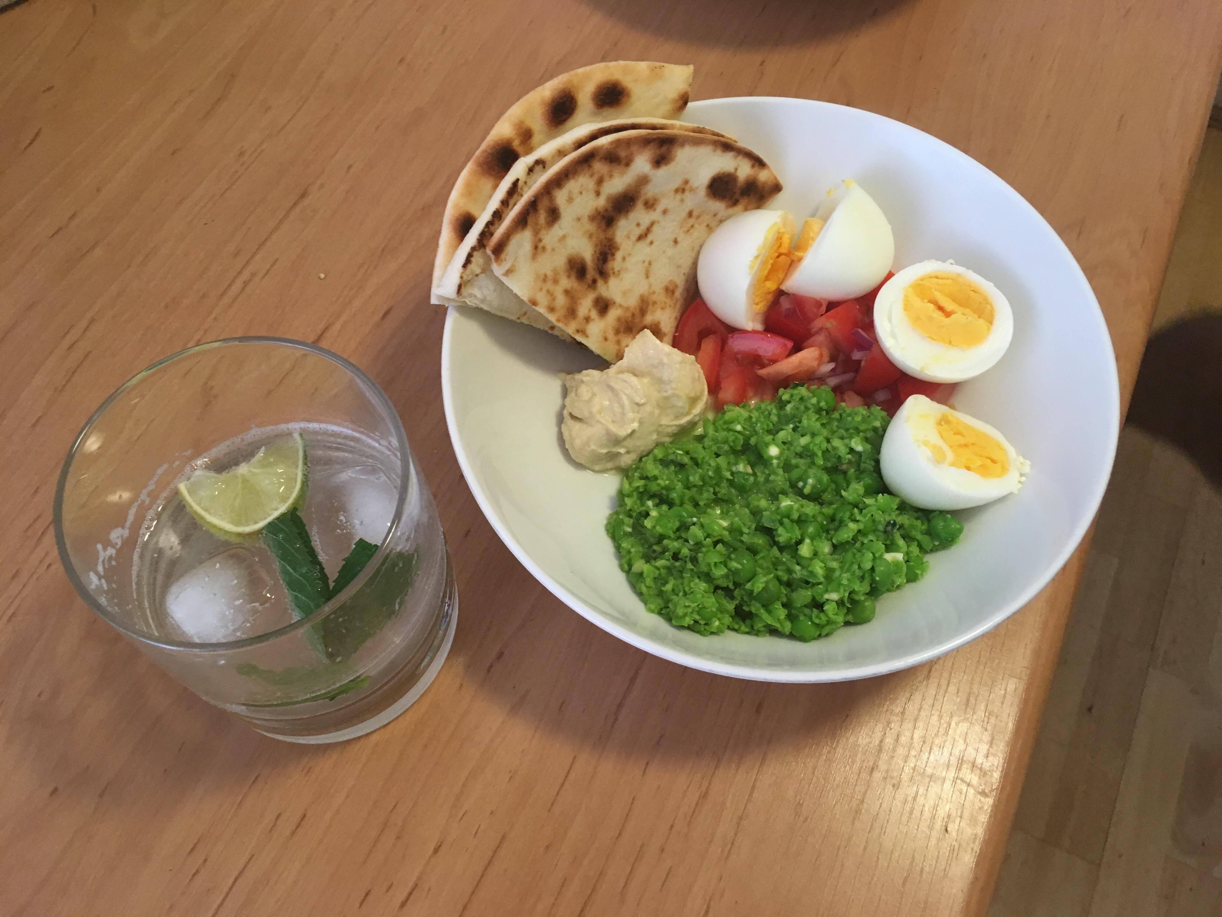 Pea, mint and feta smash, with pita bread, hummous and eggs. HealthyFood
