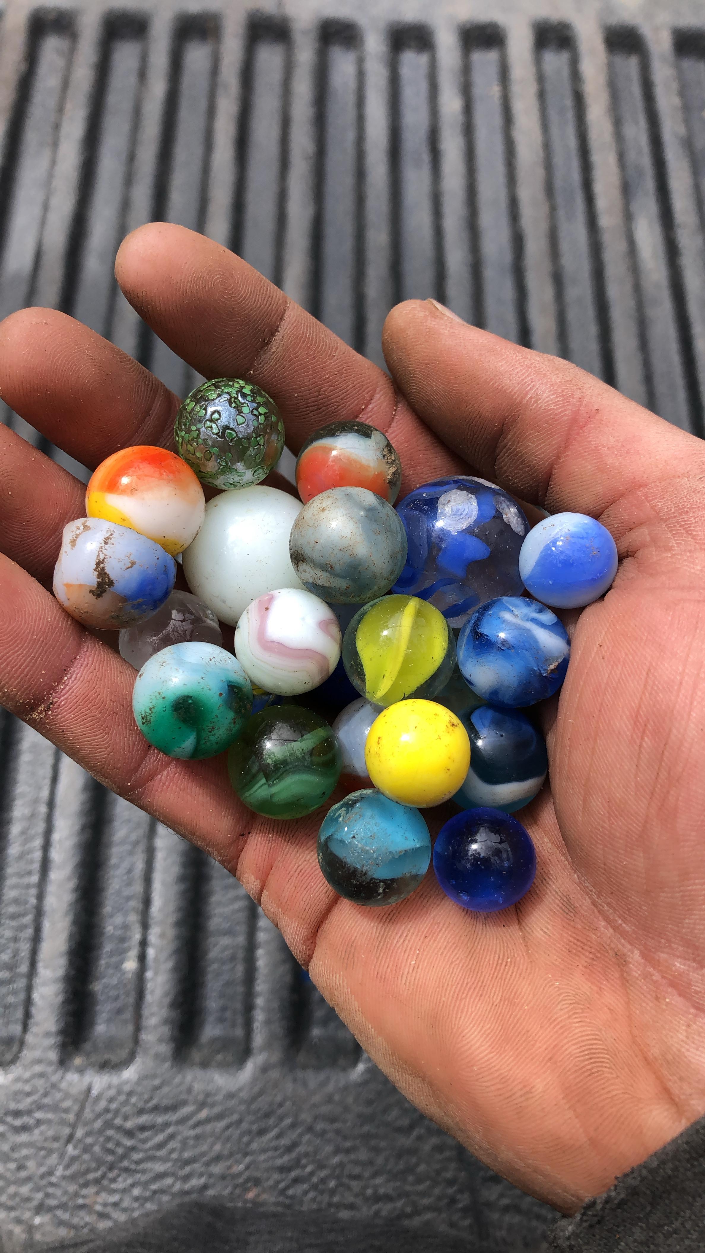 I’m a landscaper. These are all the marbles I’ve found while digging in customers gardens over