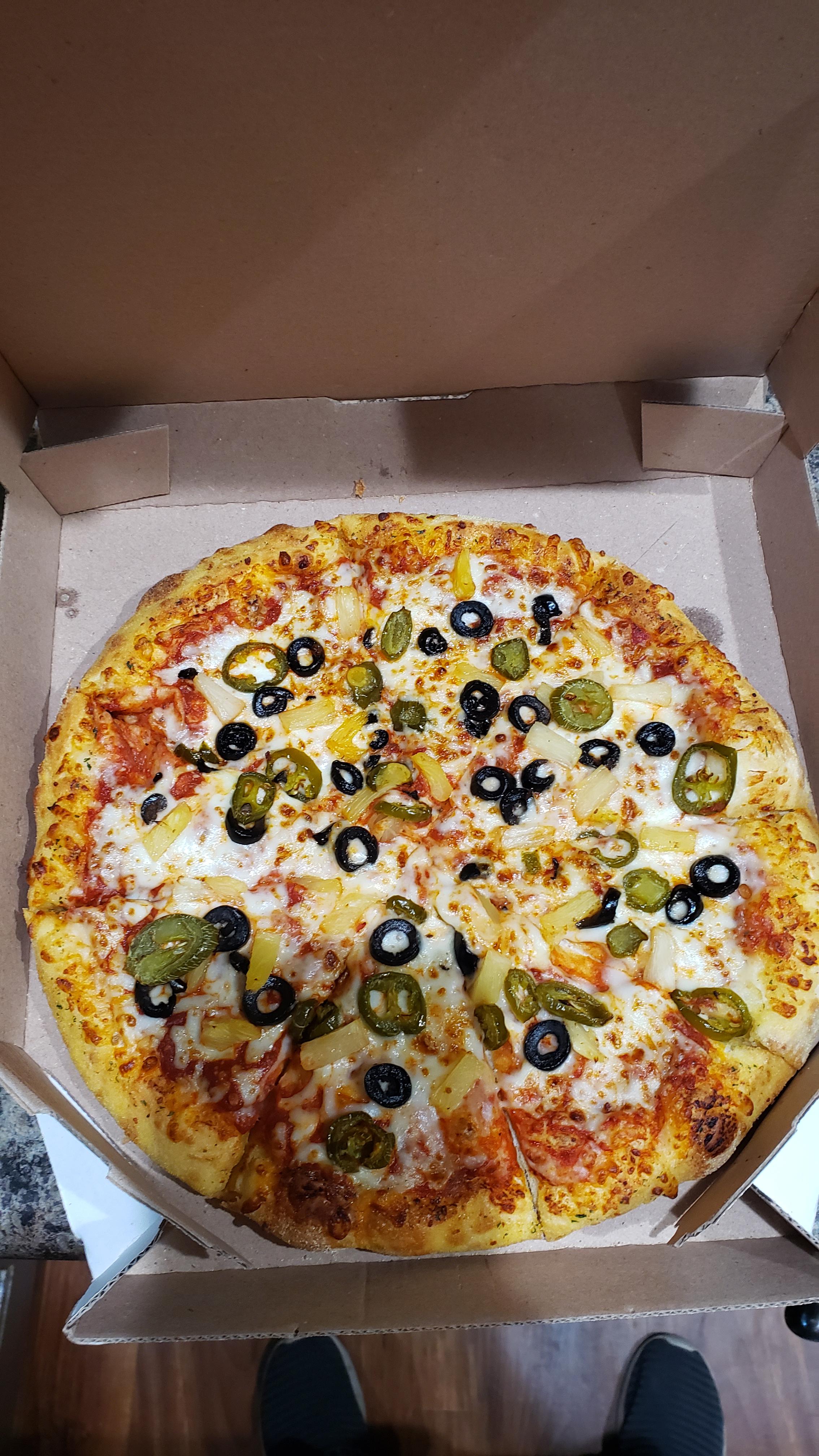 Trying Ethan's Dominos pizzas with pineapple, olives and jalapenos. I