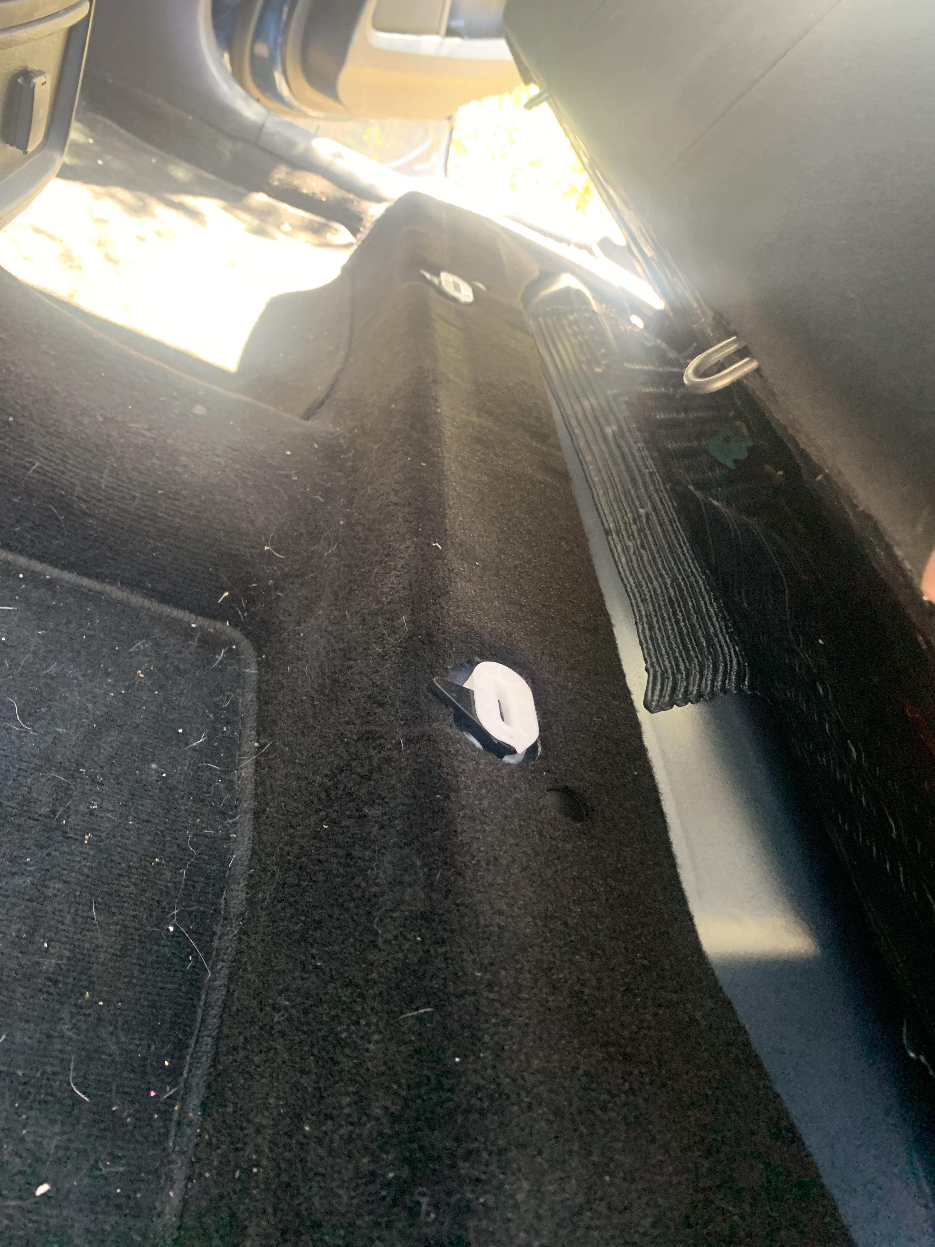 2018, I found these little clips under the back seats that let you lift