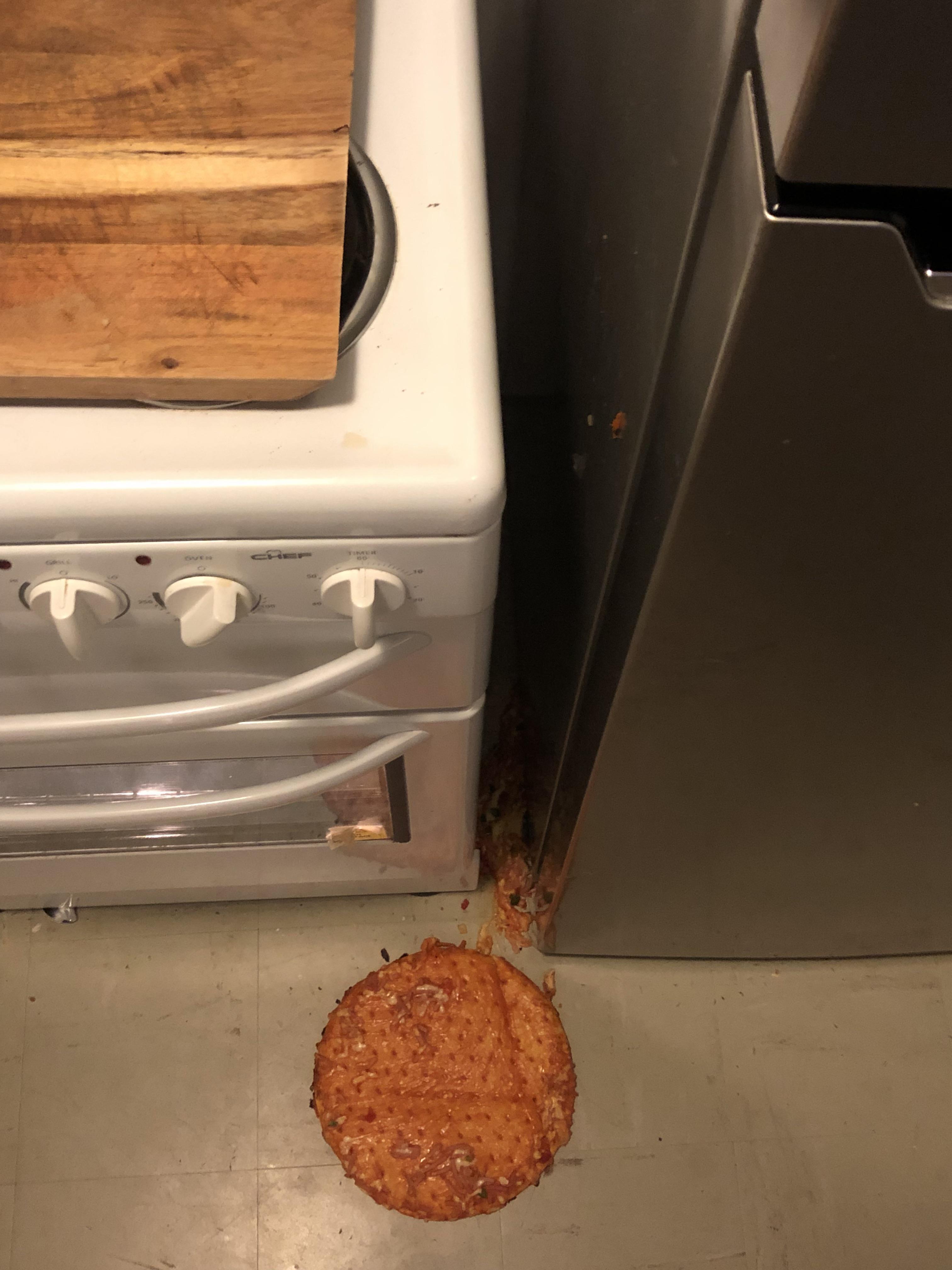 My fresh out of the oven pizza slipped off the pan and fell between my