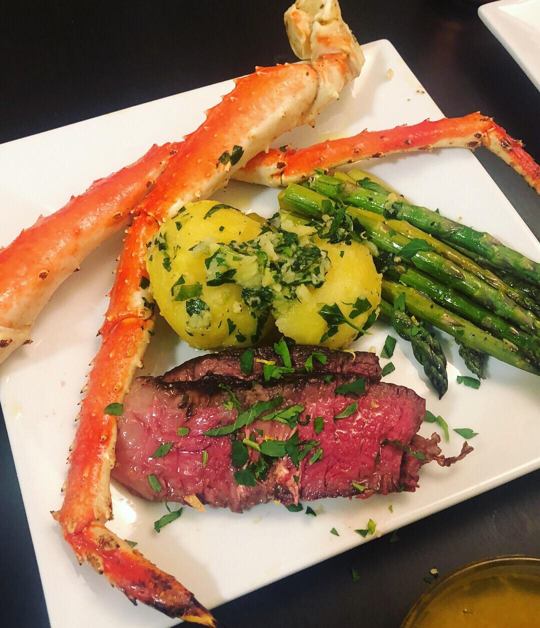 Reverse seared Tomahawk steak, baked king crab legs, roasted asparagus