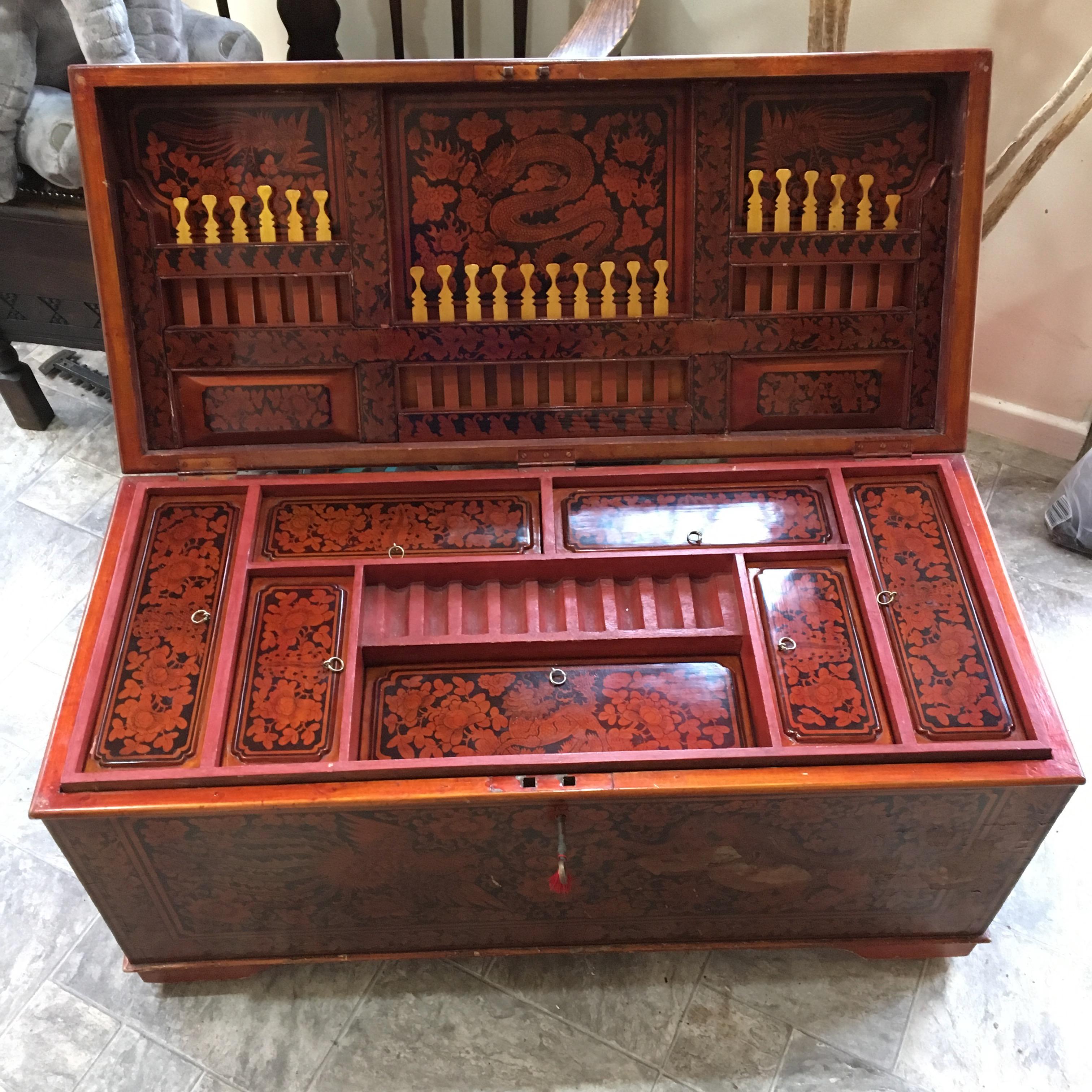 Chinese chest with removable gold handled sticks and large cavity