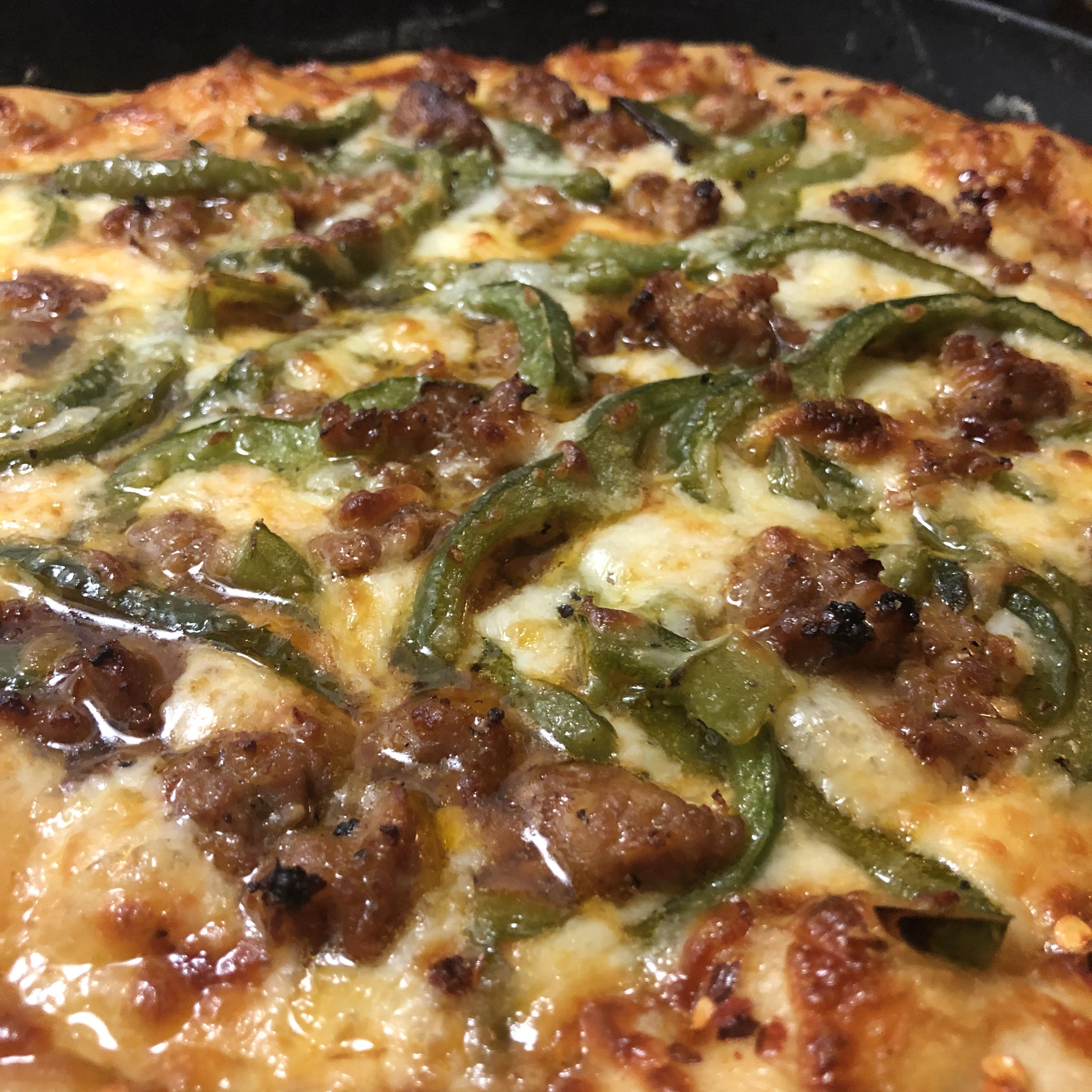 More pizza? More pizza. Hot Italian sausage and peppers made heavenly. r/castiron
