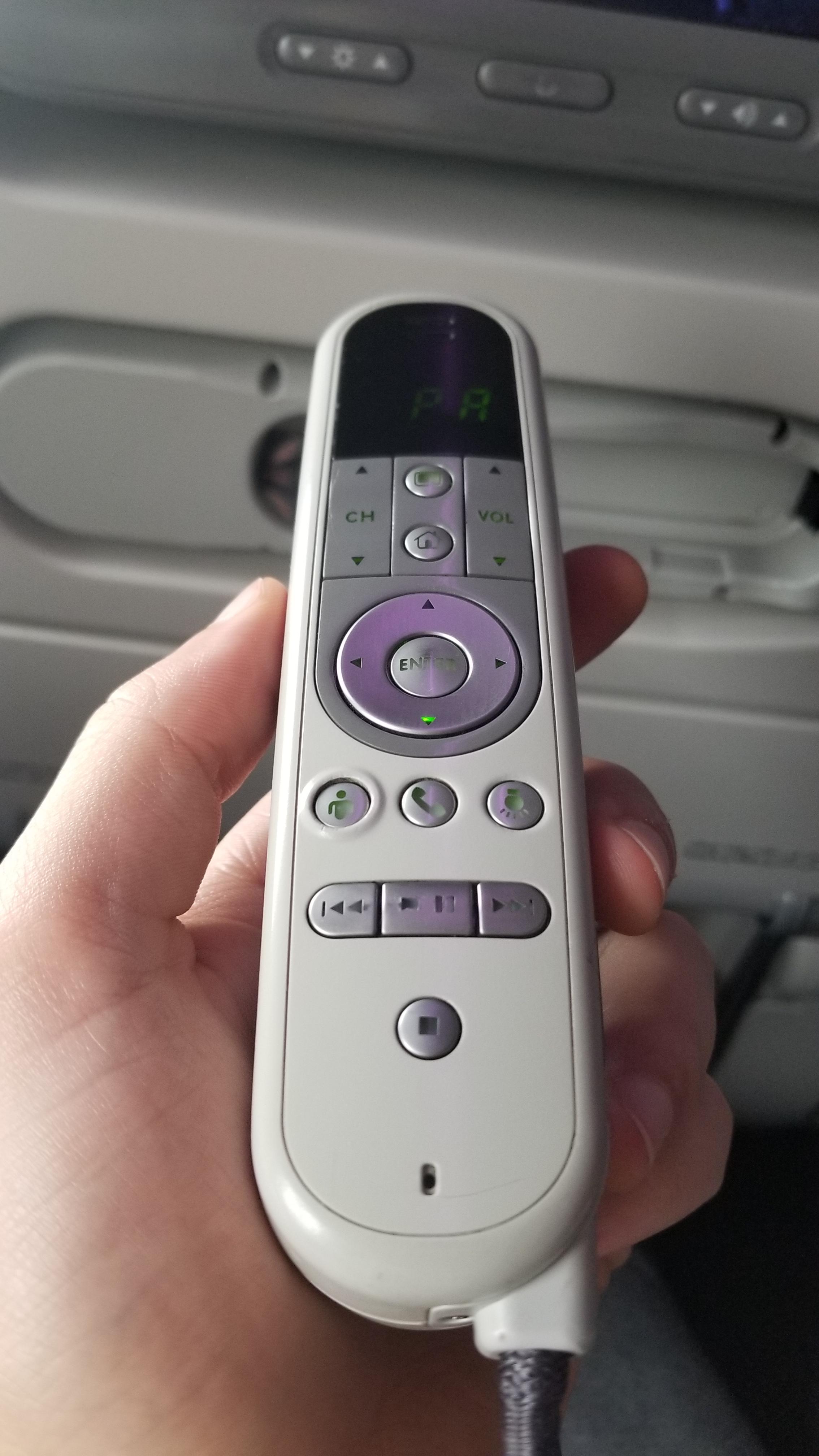 This airplane TV remote has a divot for the flight attendant button so