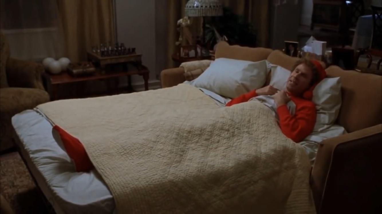 Buddy the Elf sleeps with his feet sticking out the of the covers