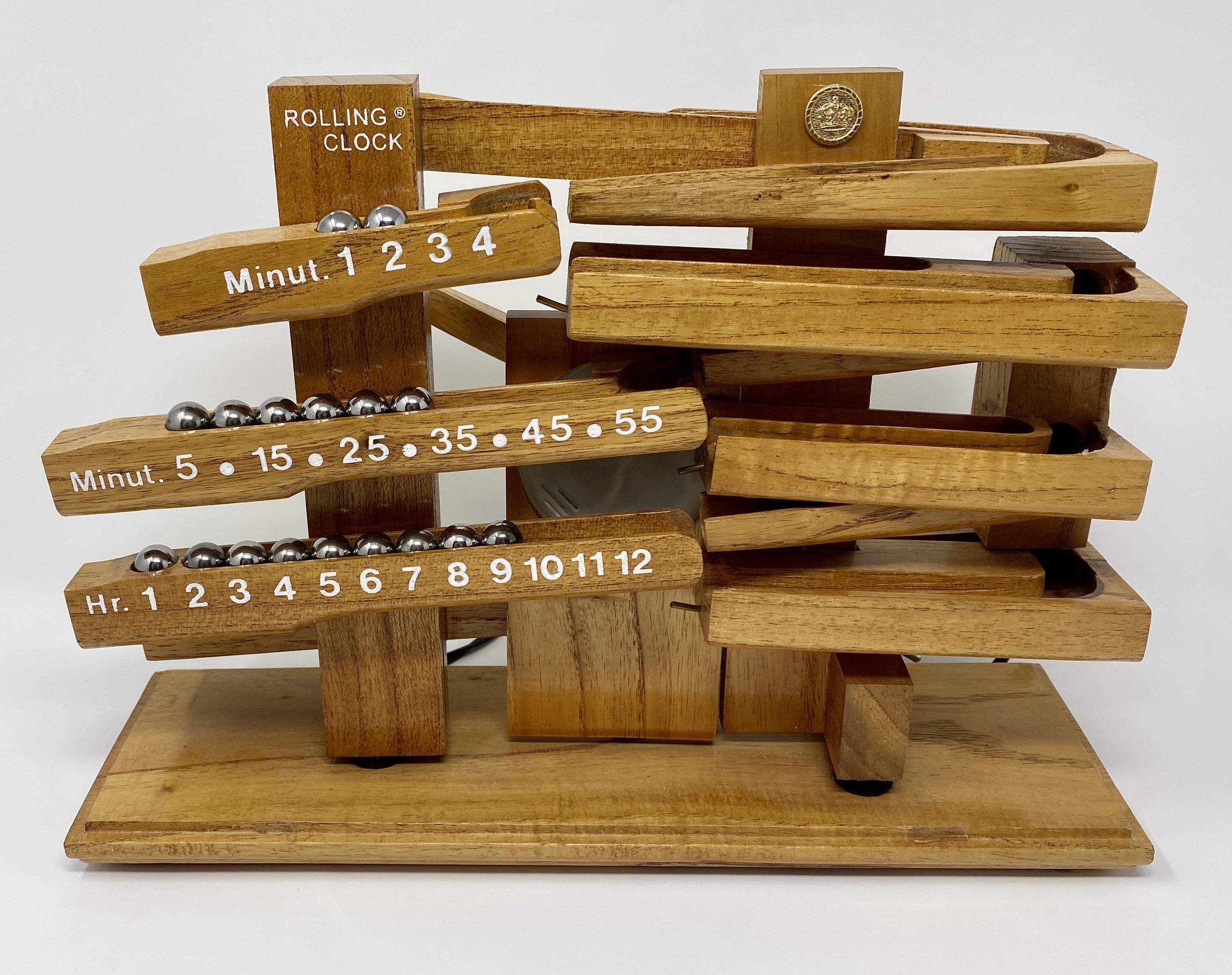 This clock uses steel balls to show the time r/mildlyinteresting