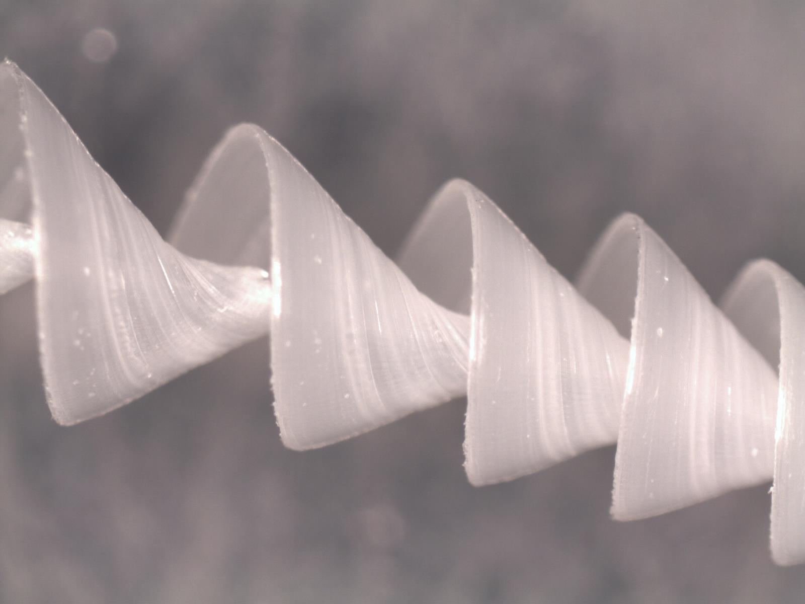 Plastic Shavings from a Drill Press at work under a Microscope r