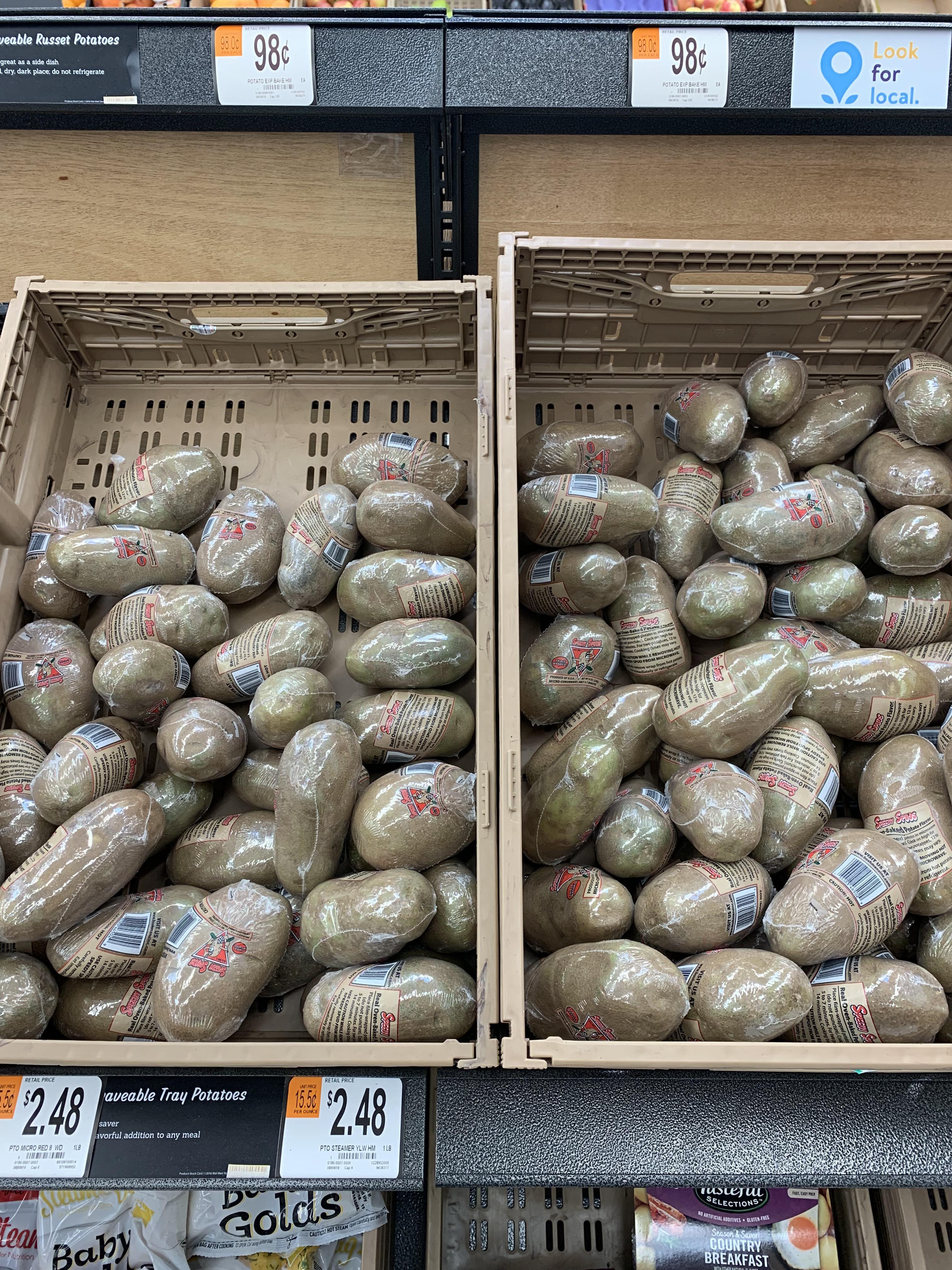 Individually plasticwrapped potatoes. Because microwave, apparently