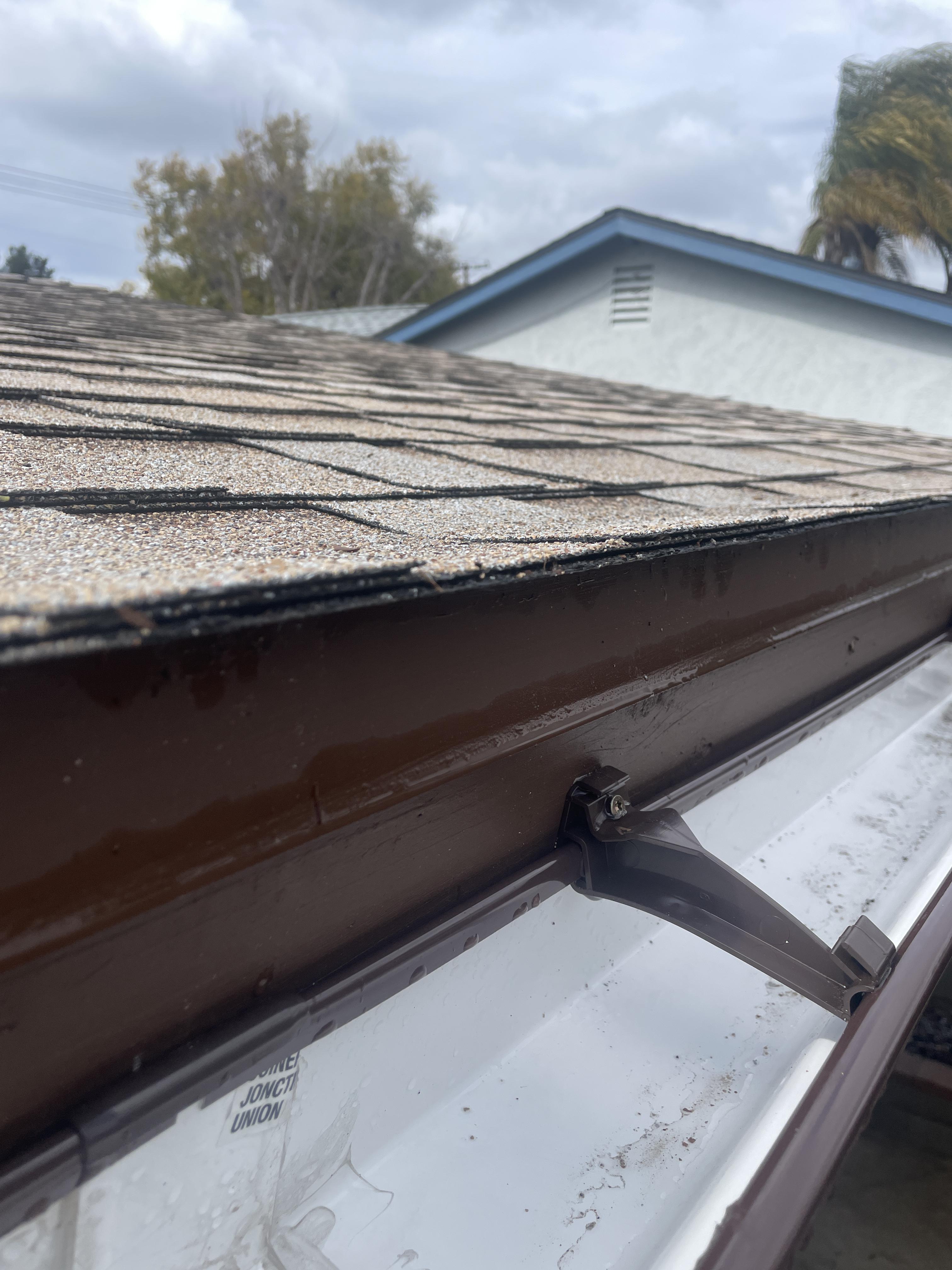 Drip edge pushing up on shingles creating a valley for water to collect and run underneath
