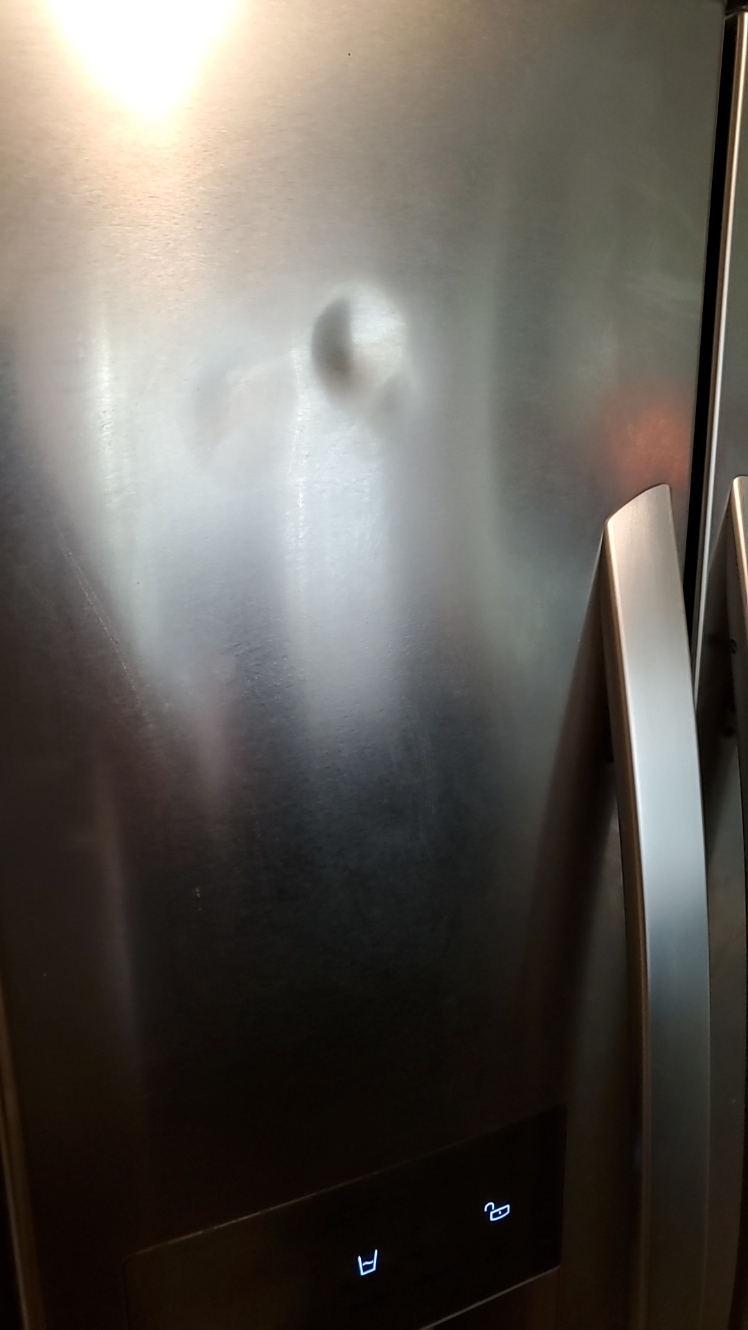Refrigerator stainless steel door dent repair. Does anyone have ideas on how to repair this