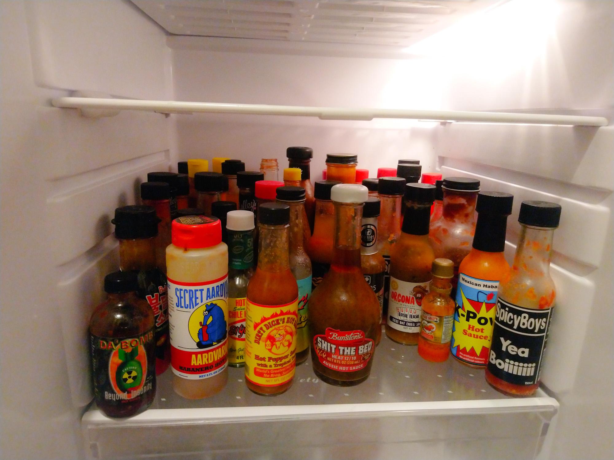 My beer fridge has turned into a hot sauce fridge. r/spicy