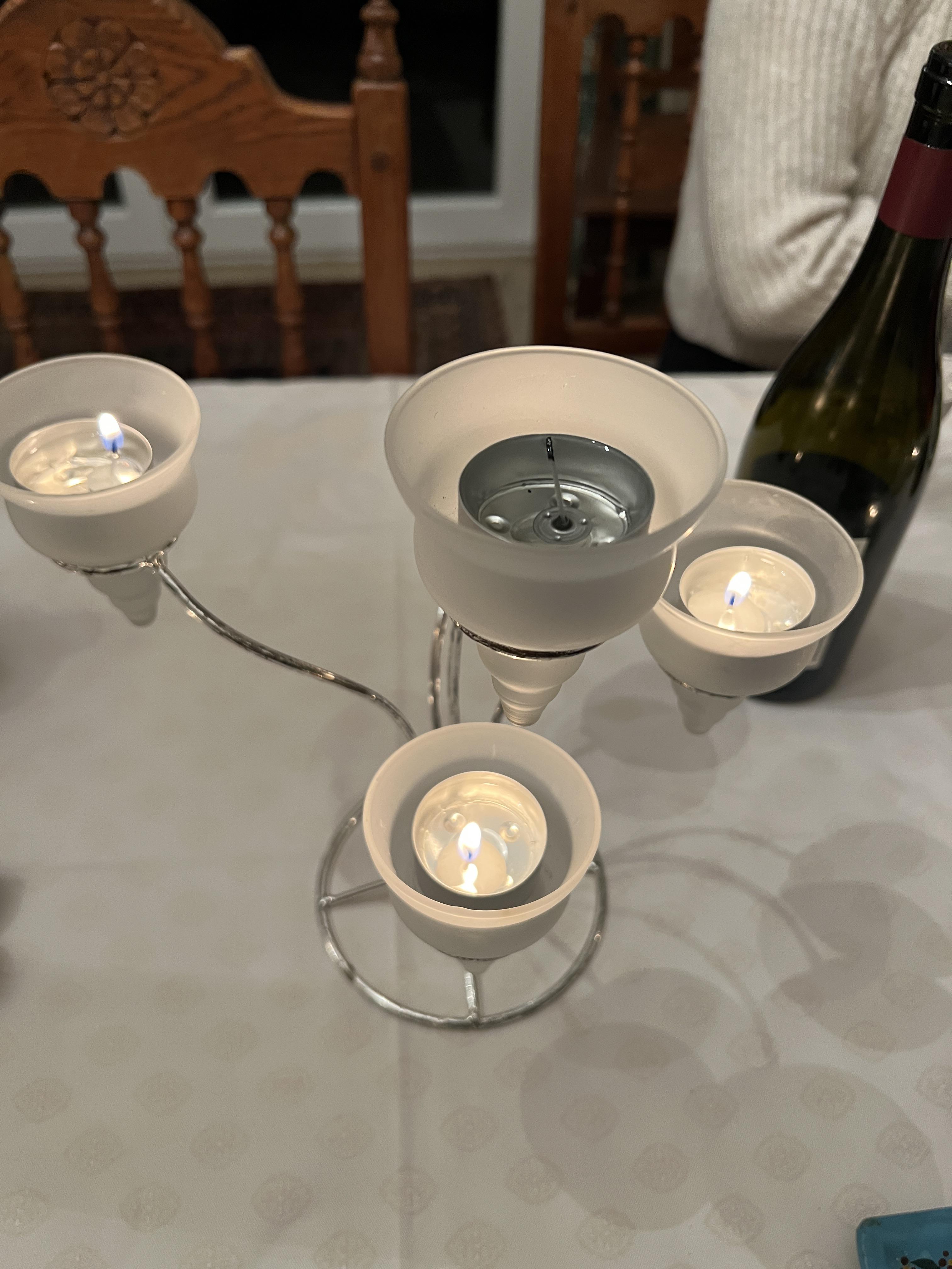 Candelabra badly designed so it overheat the upper candle and make it