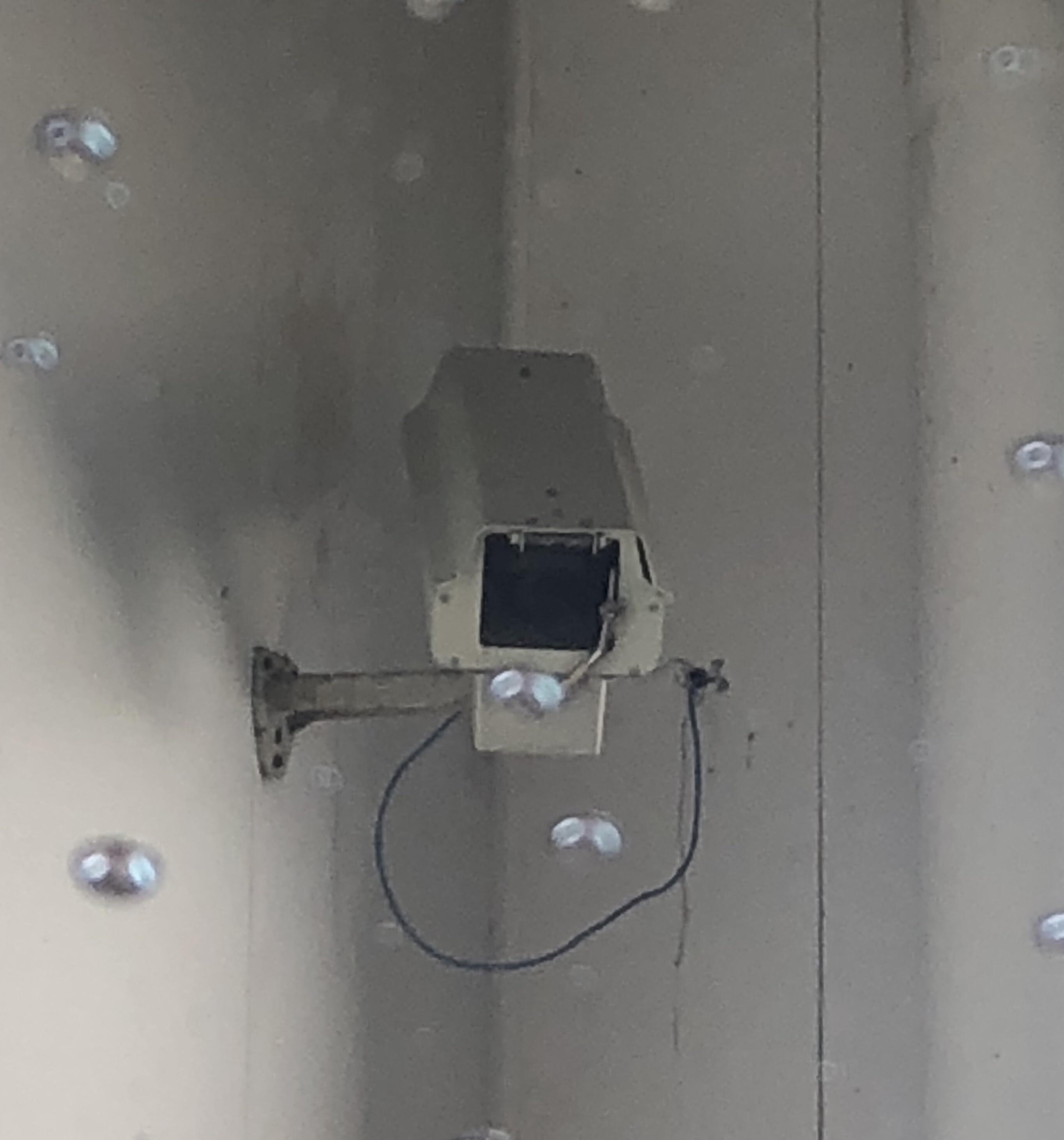 This security camera inside a car wash has its own tiny windshield
