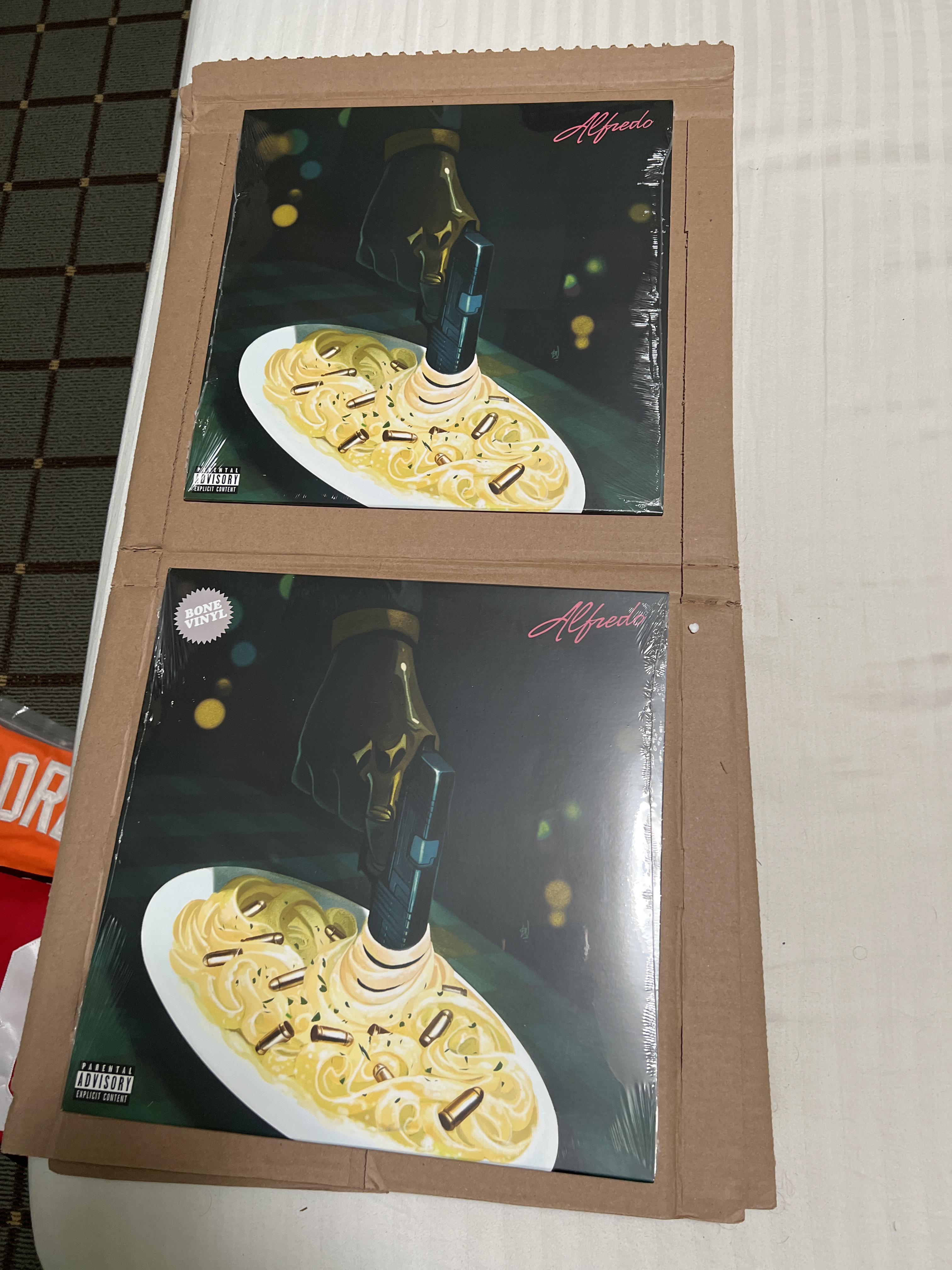Two limited edition Alfredo Vinyl for sale. The Black variant and the