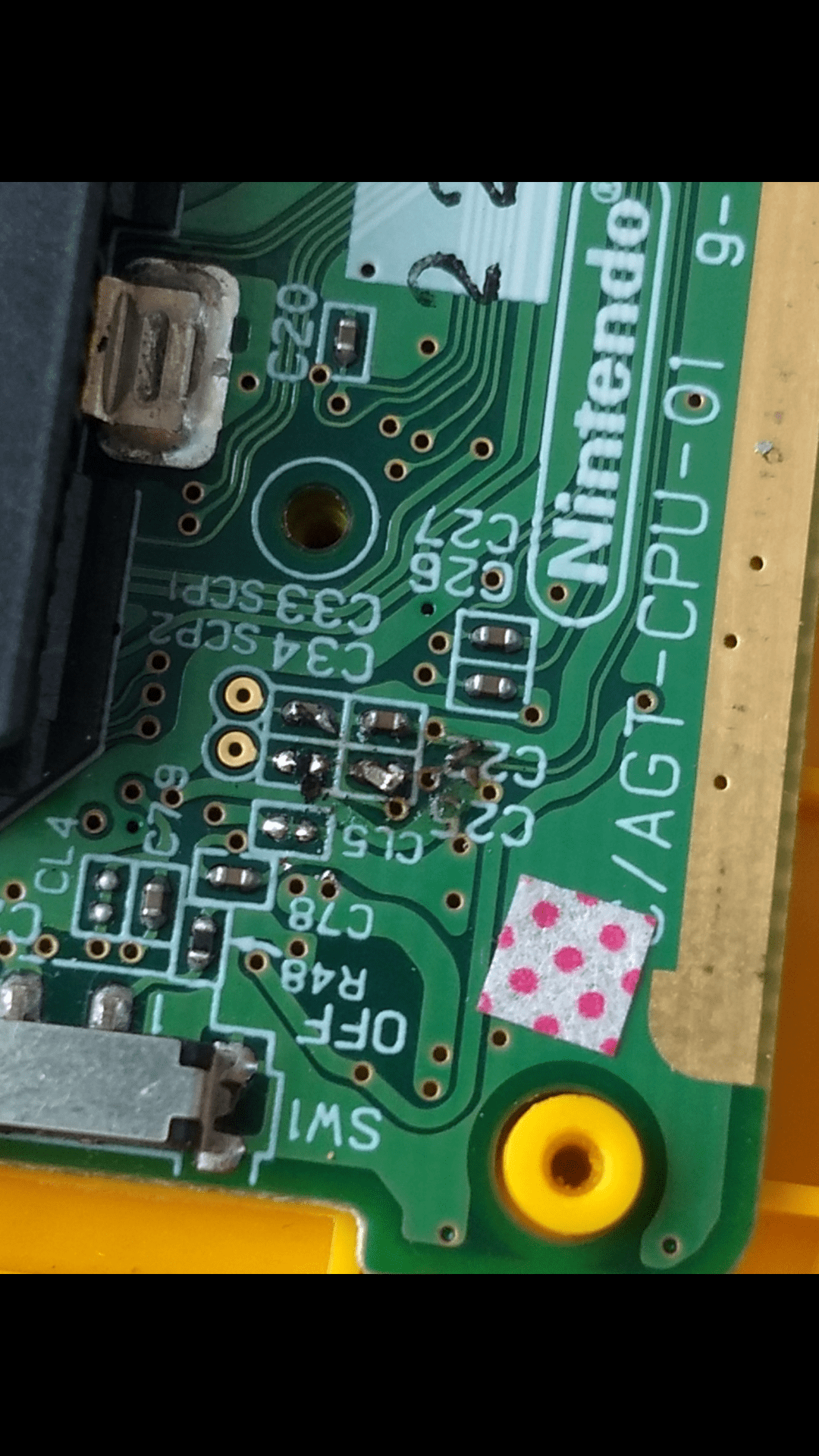 What are the little brown boxes on these motherboards, and can I