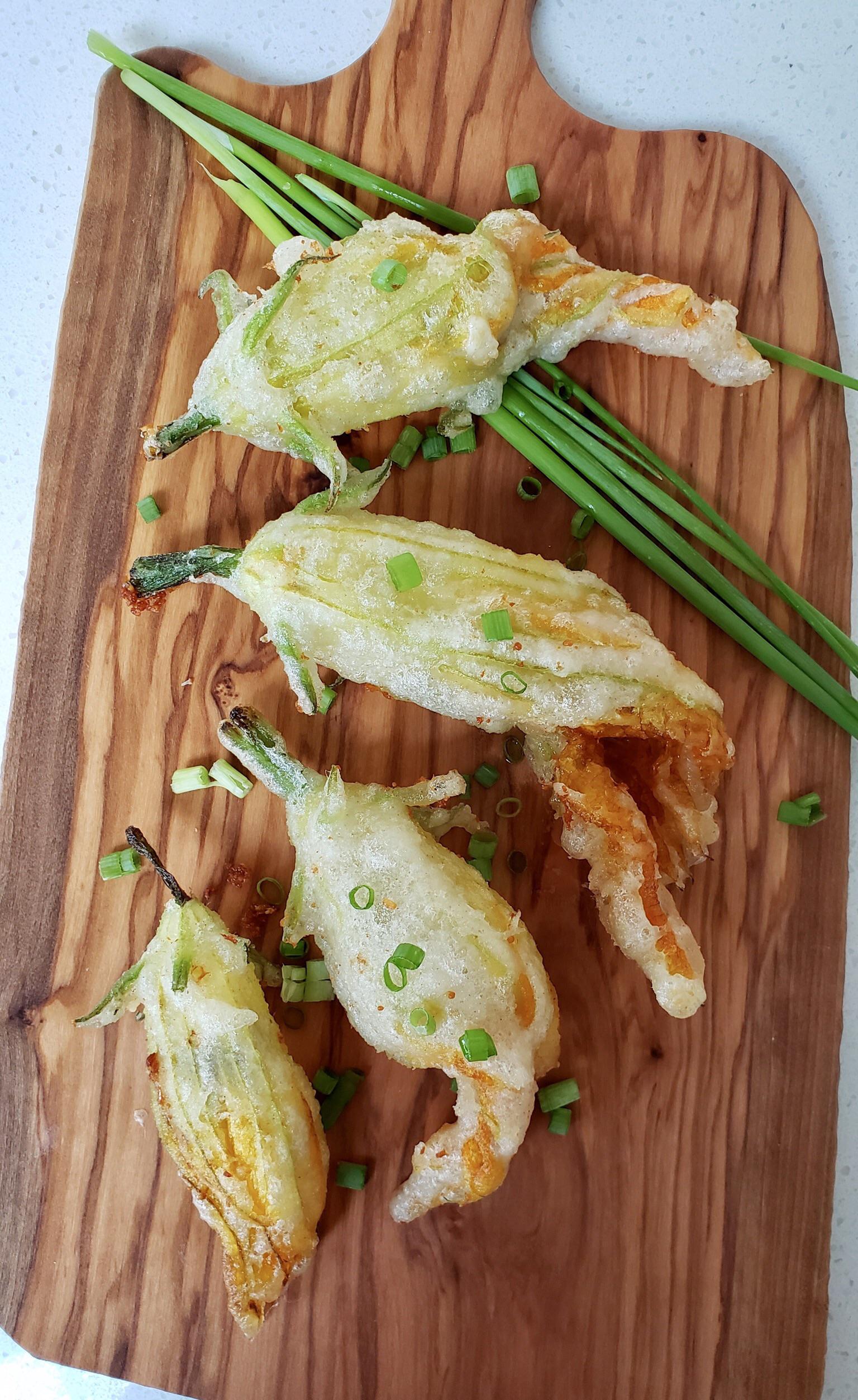 Zucchini flowers stuffed with anchovy’s and mozzarella. I had these in