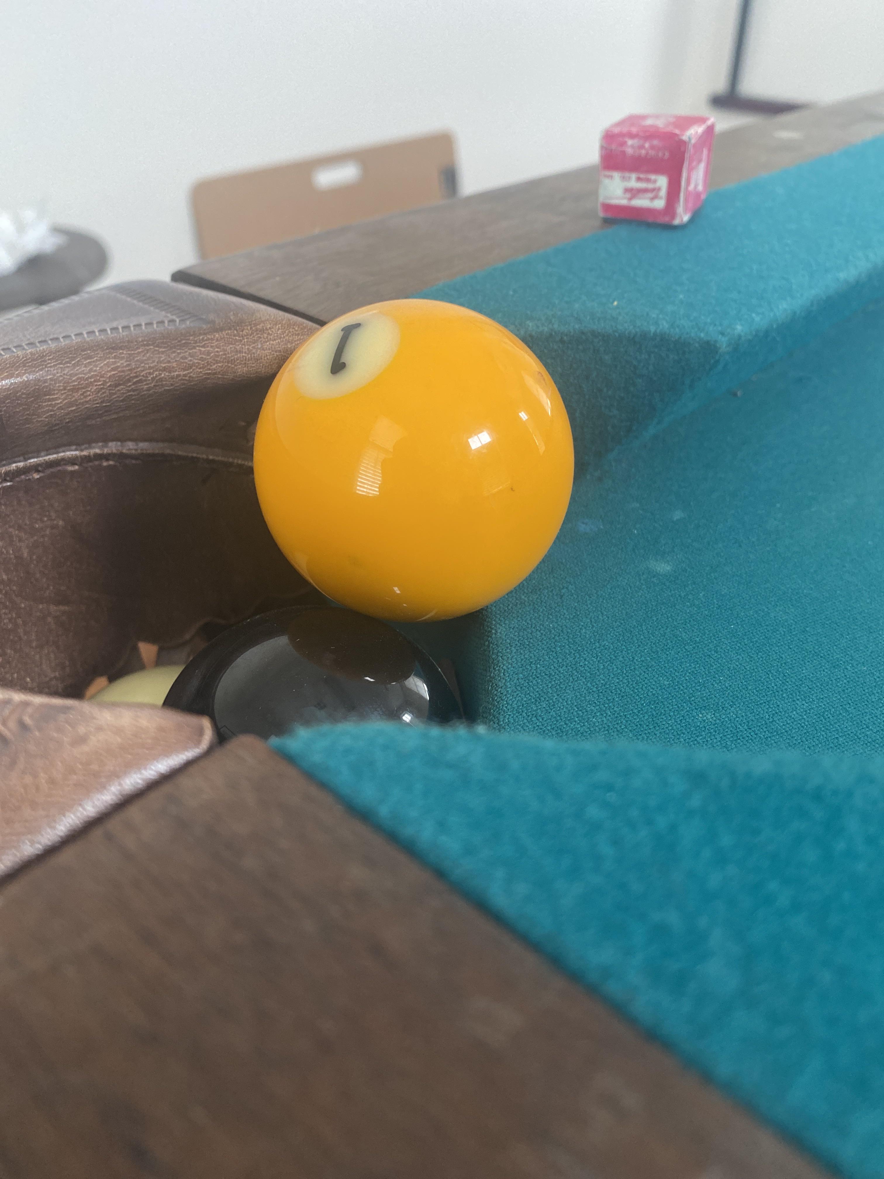 Drop pockets are full. Shot goes in clean but rests on other ball. Ball