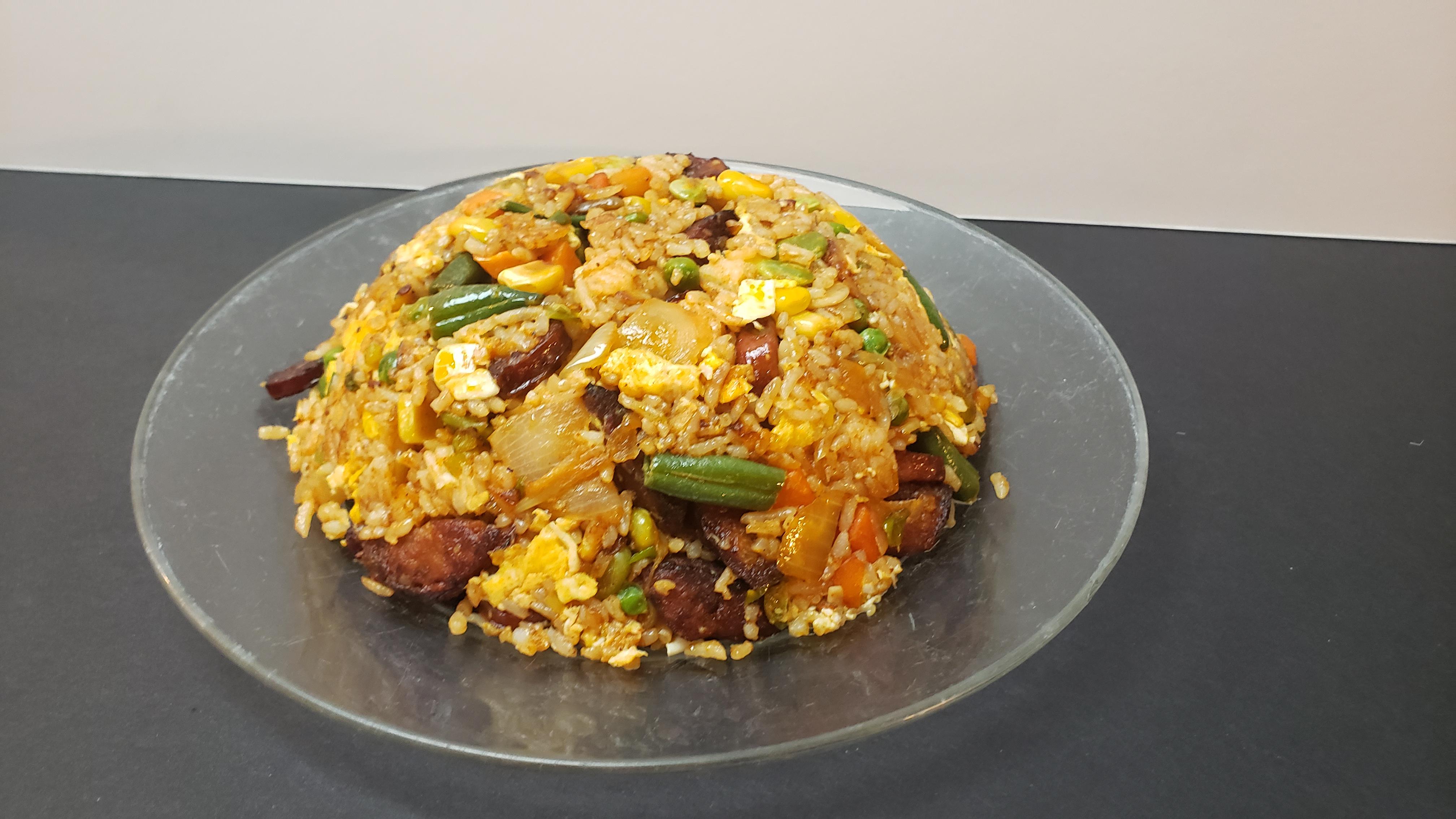 Spicy leftover fried rice made with sausage egg frozen vegetables and