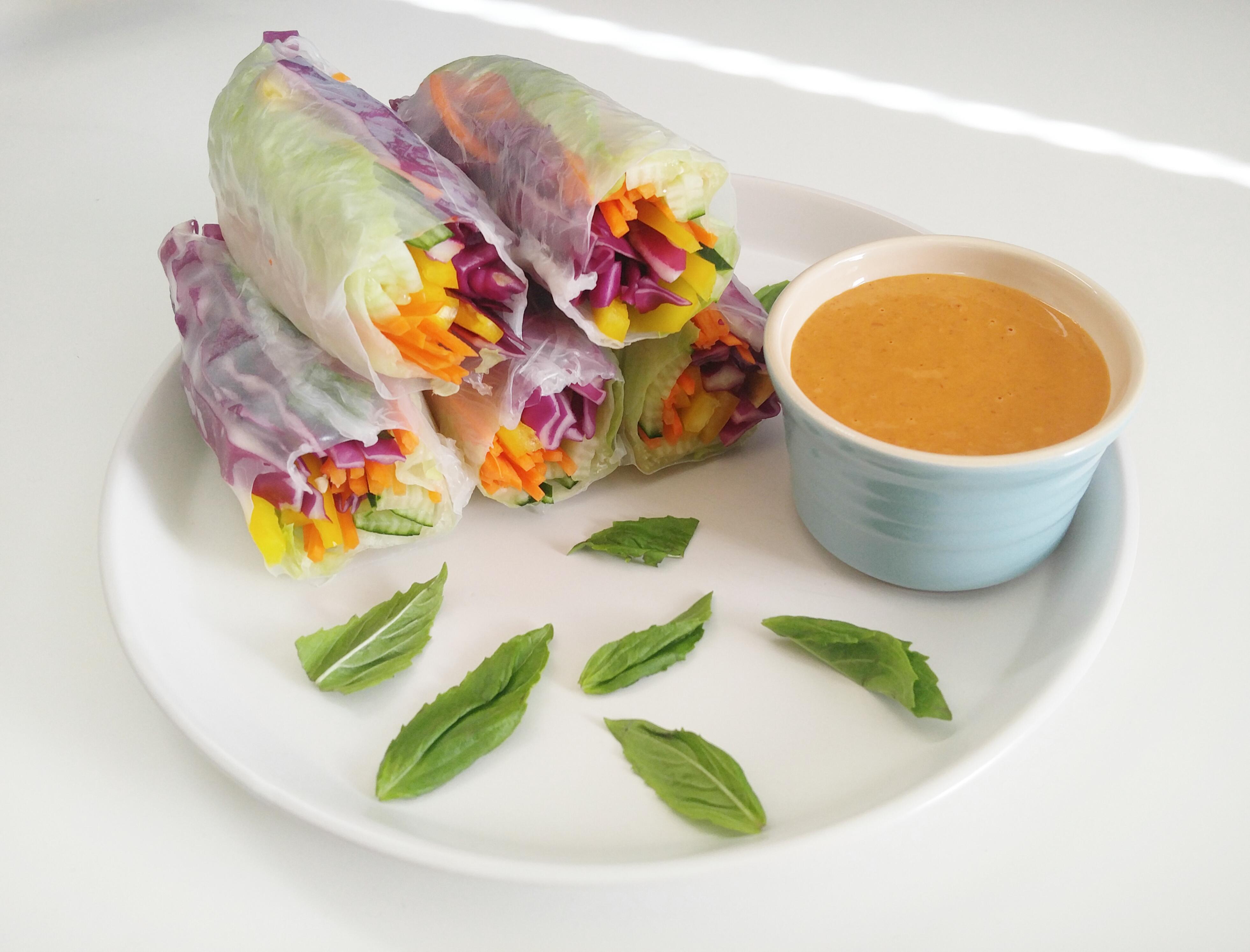 Tasty veggie spring rolls with a spicy peanut sauce. Colorful, light