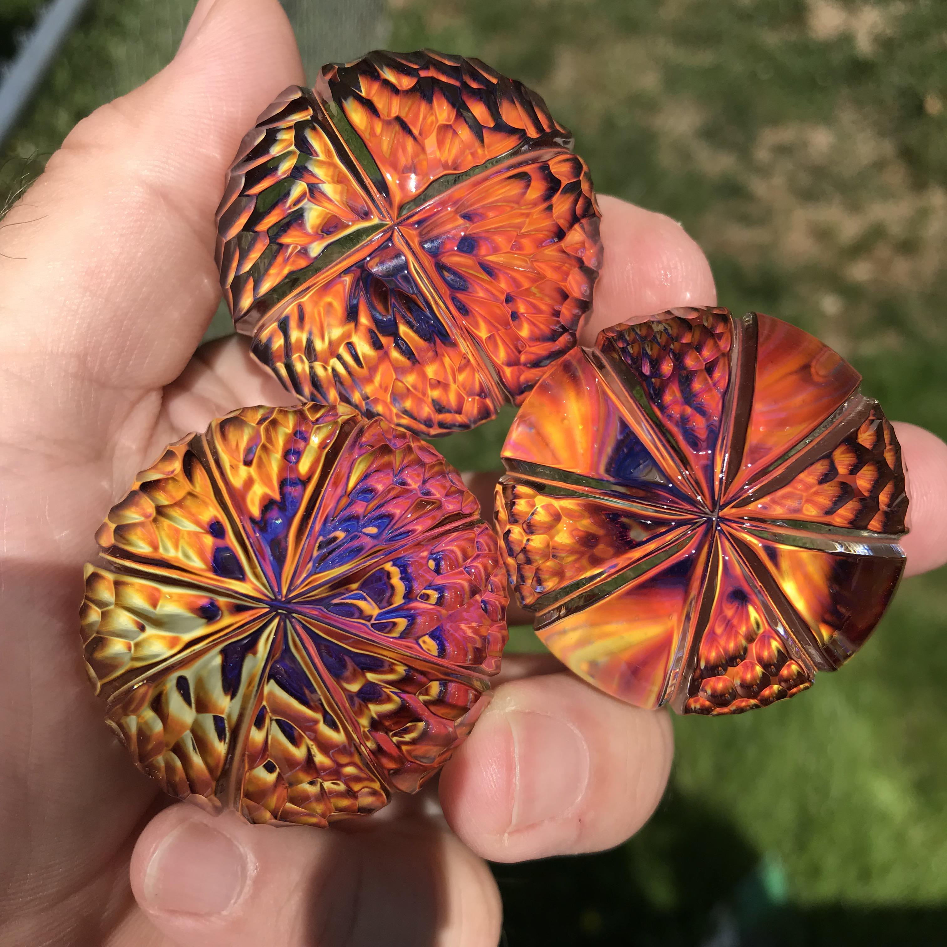 Made and then carved these glass marbles. Caught some fire I think. r/interestingasfuck