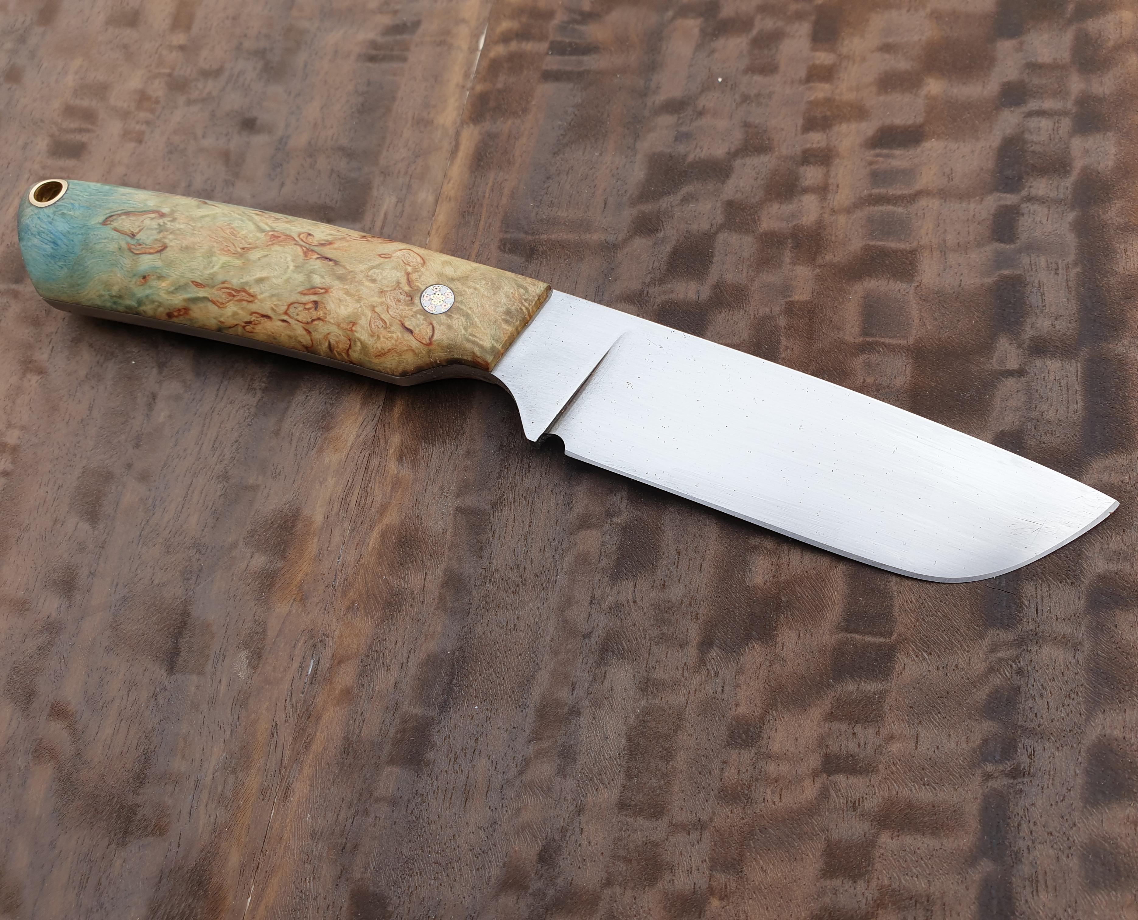 My latest knife. D2 steel and dye stabilized karelian birch scales. r