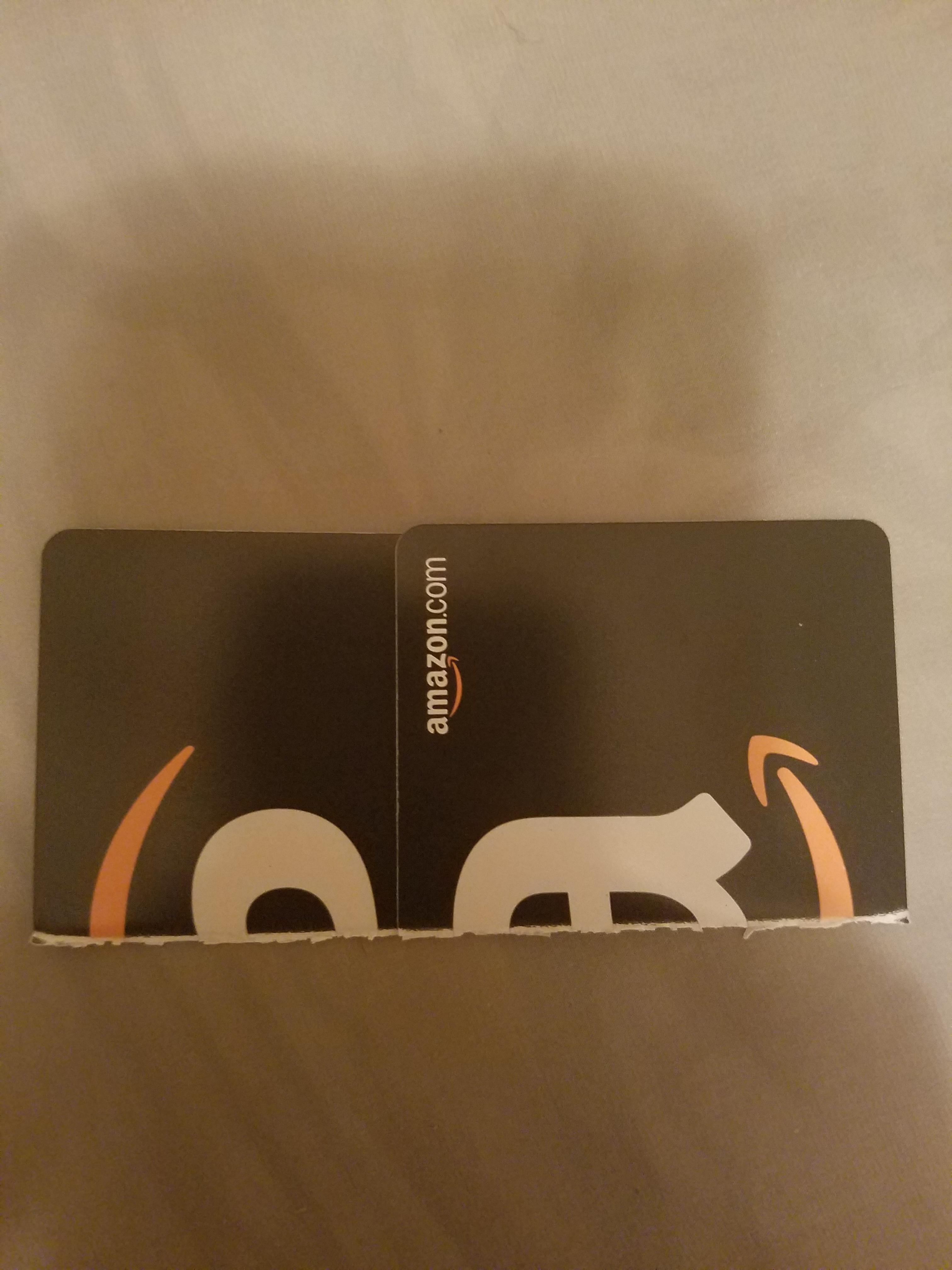This Amazon gift card cut in half looks like a bear leaving a cave near